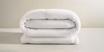 Duvet blanco enrrollado