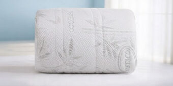 protector de colchon blanco enrrollado
