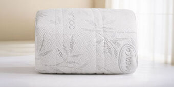 protector de colchon blanco enrrollado