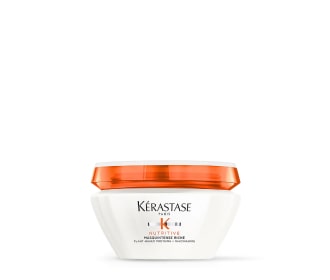frasco blanco con tapa naranja de la marca kerastase