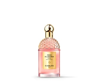 imagen de perfume rosa con tapa y etiqueta dorada, guerlain