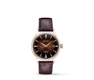 reloj plateado con correa cafe SEIKO