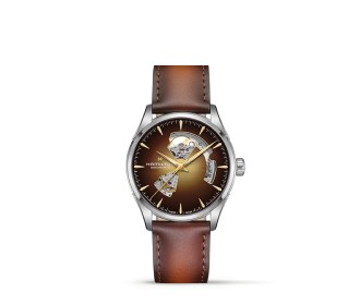 Reloj plateado con extensible cafe de piel. HAMILTON