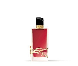 Imagen de un frasco de perfume color durazno con moño en la tapa