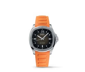 Reloj plateado con caratula negra y cintillo naranja, MIDO