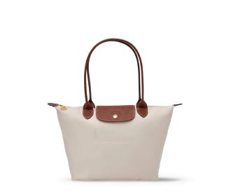 Imagen de un bolso blanco con cafe