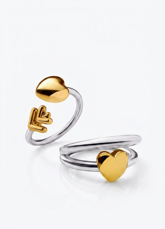 dos anillos plateados y dos dorados TOUS
