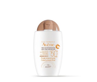botella de crema blanca con dorado