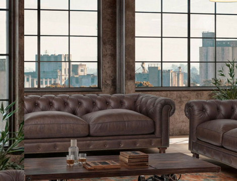 Sillon de piel color cafe en sala de estar