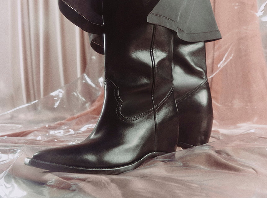 Botas altas de piel negra estilo vaquero marca Maison Margiela