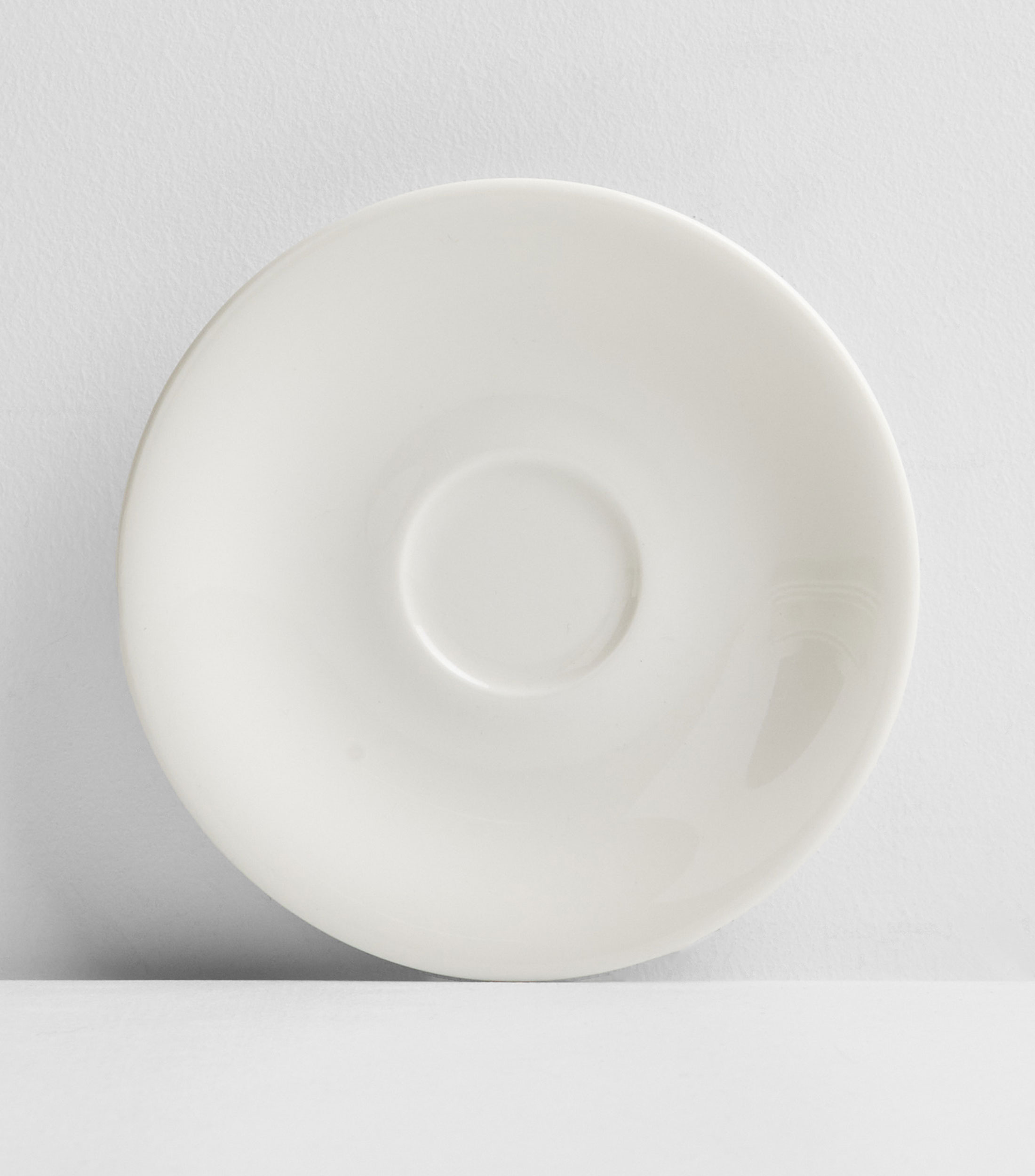 Plato para taza espresso en porcelana