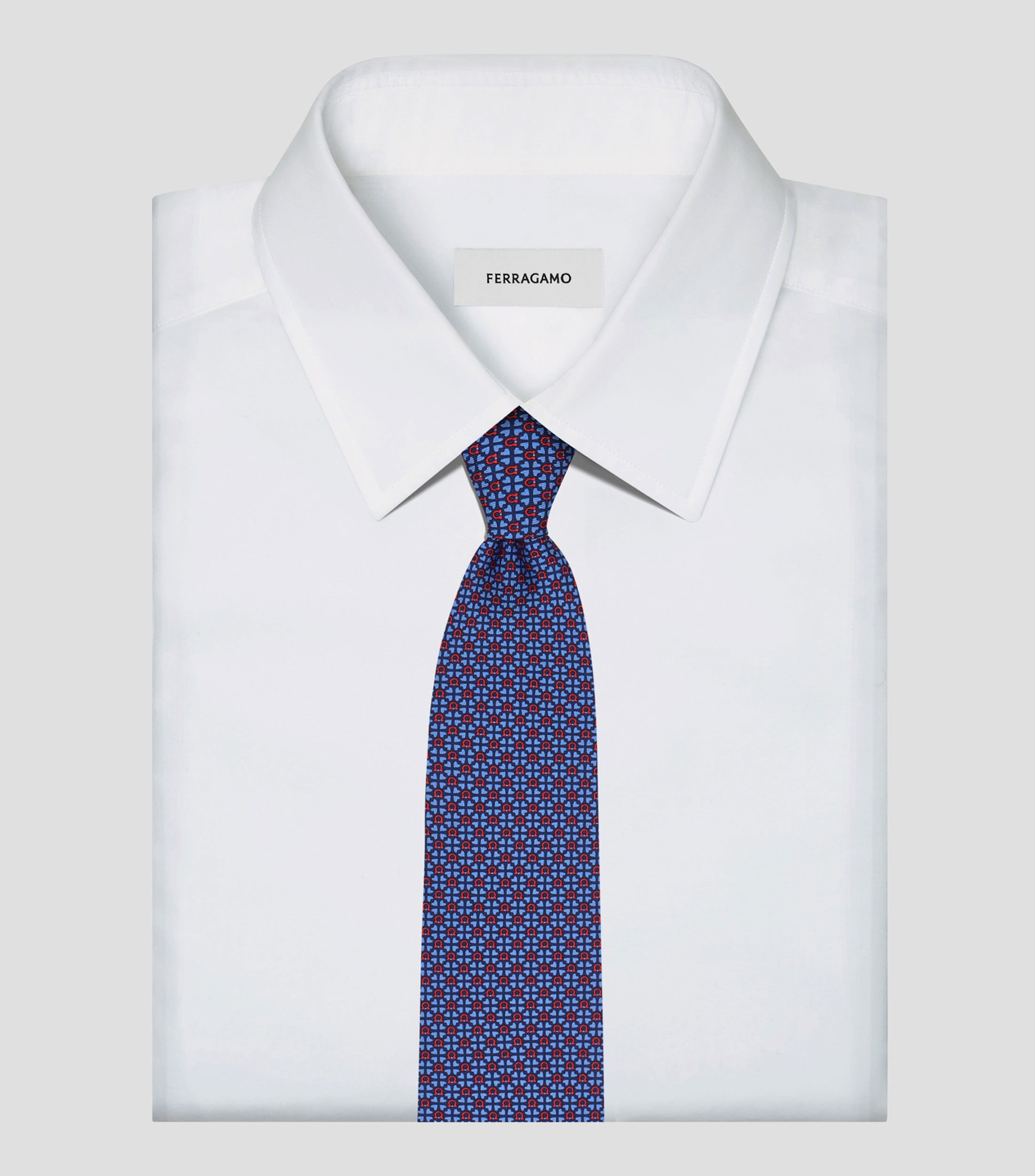 Corbata de seda estampado Gancini y corazones