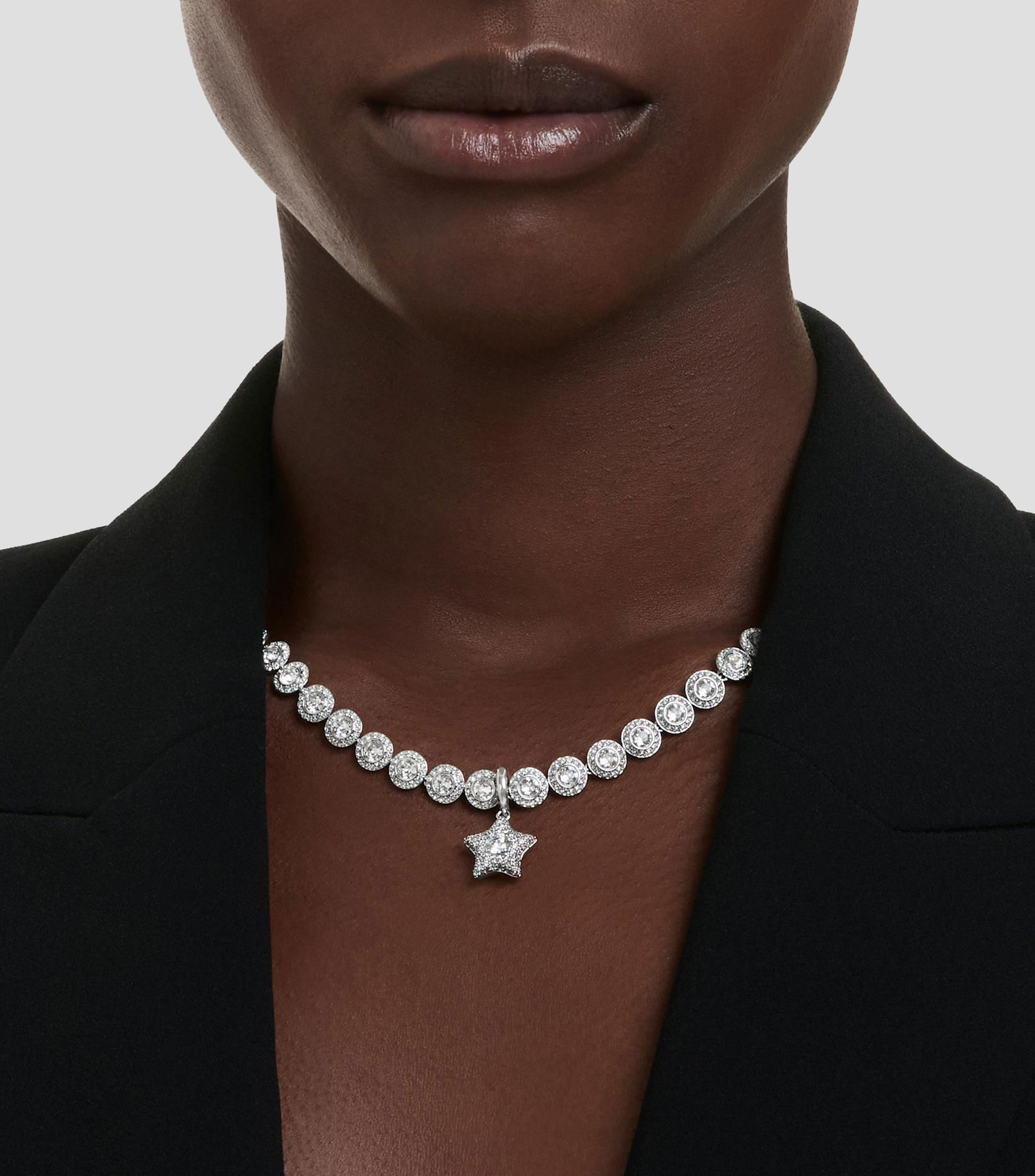 Charm en forma de estrella con cristales transparentes y piedra flotante Sublima Mujer