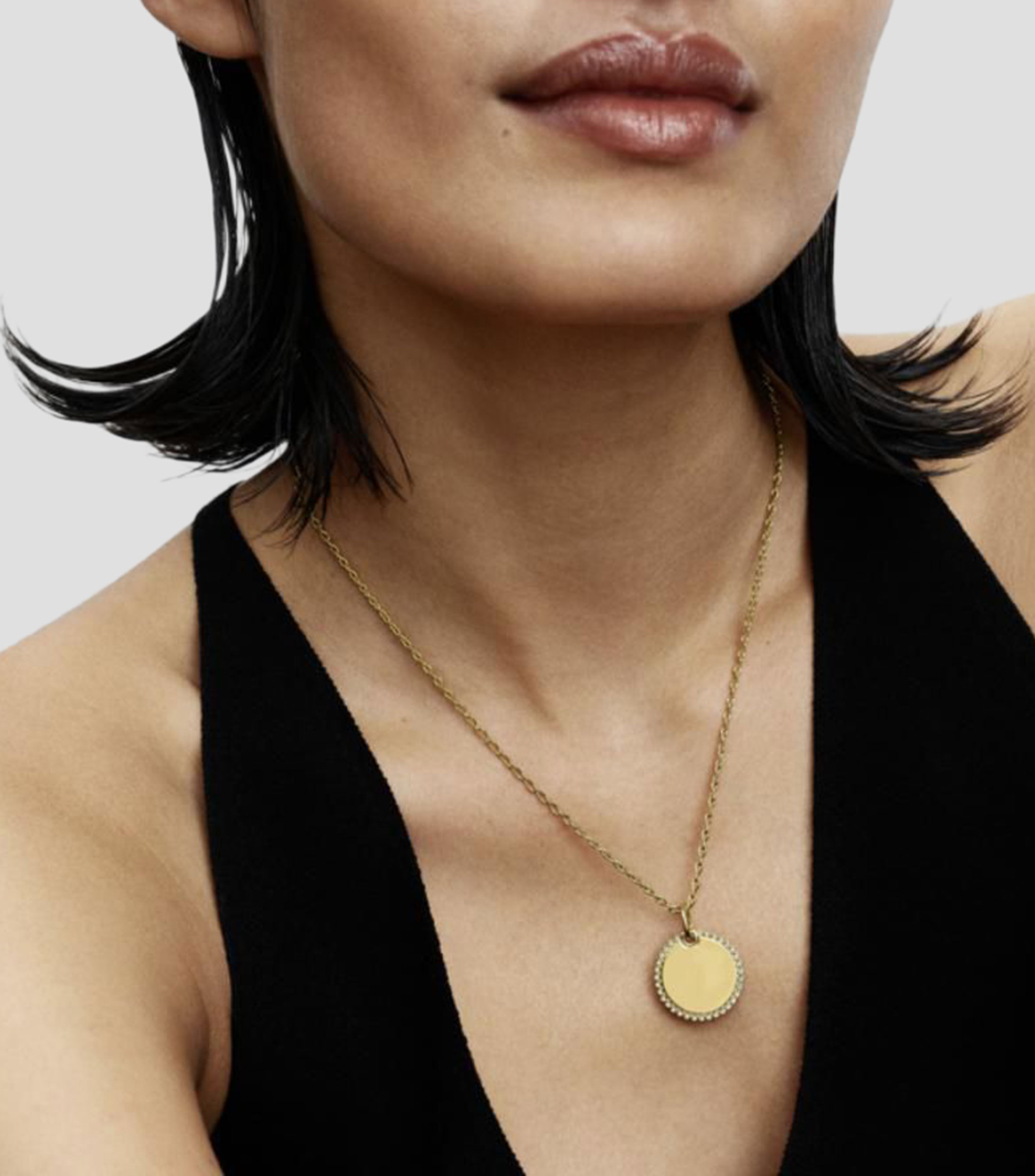 Dije redondo en plata con circonitas Mujer