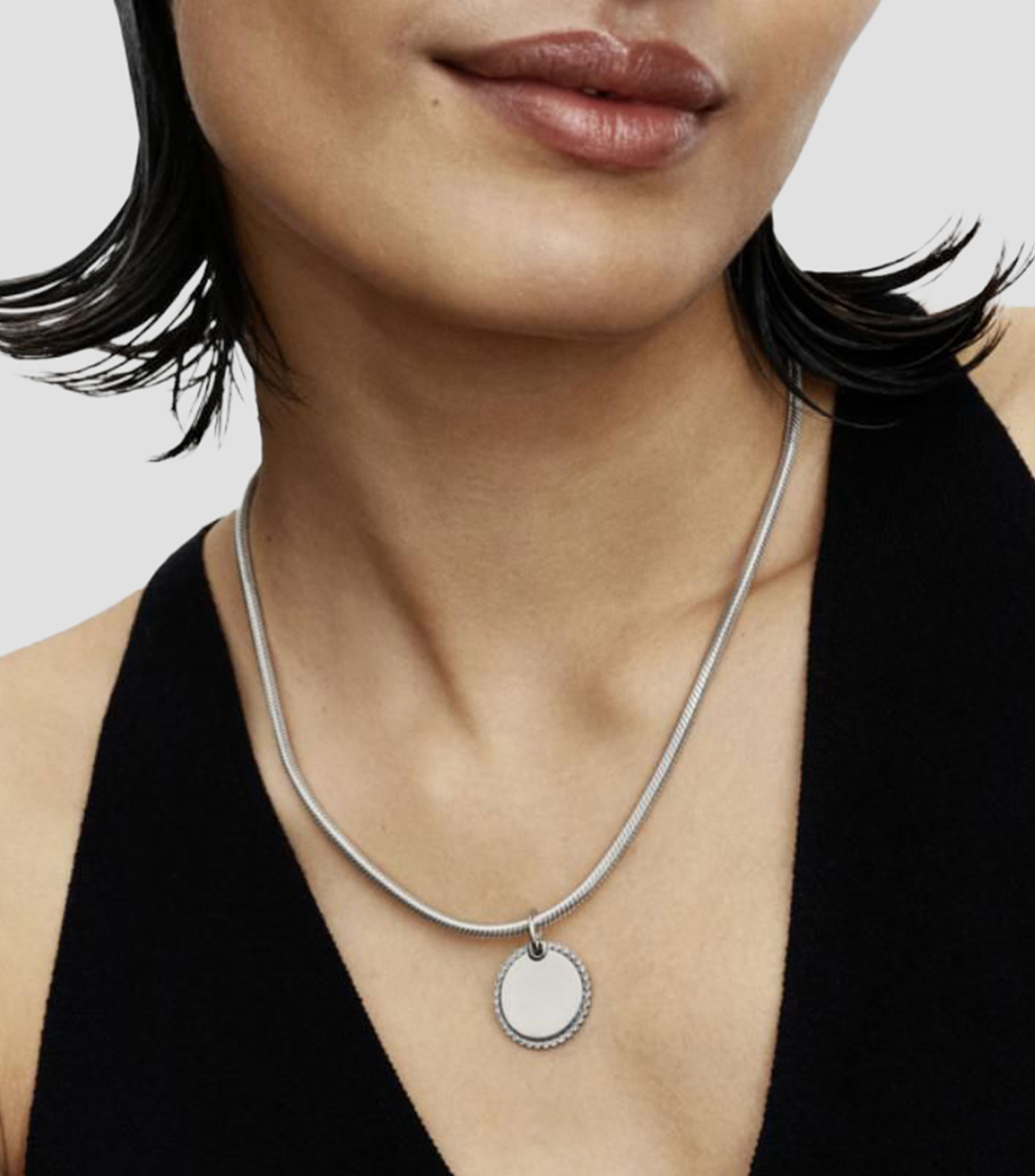 Dije redondo en plata Unisex