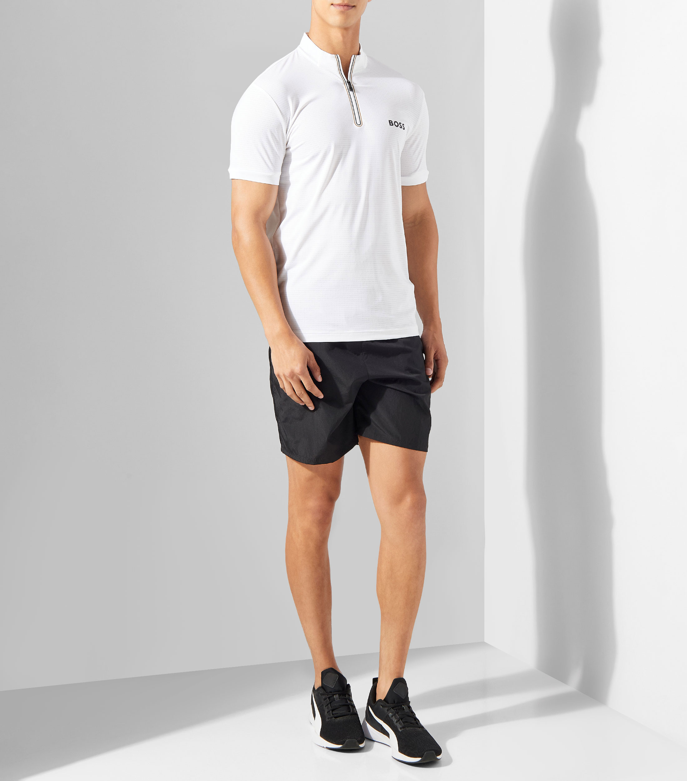 Playera con cremallera en el cuello en punto de malla elástica Hombre
