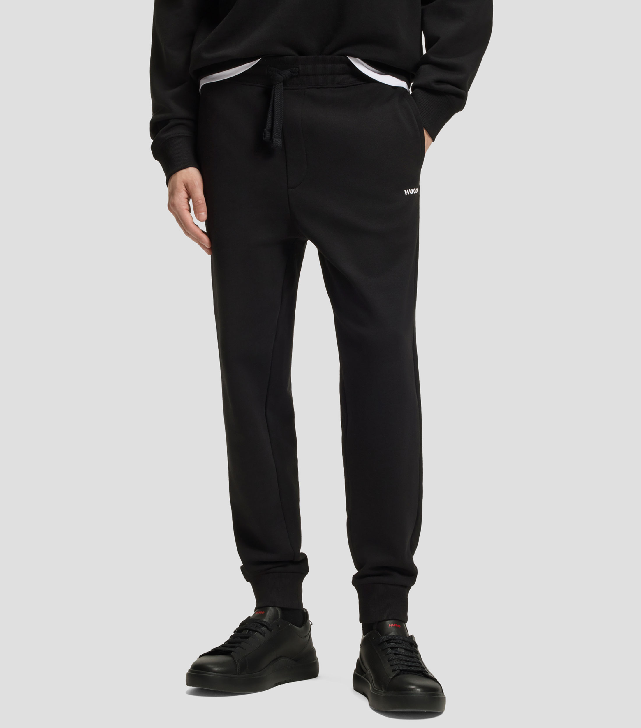 Pants Hugo de chándal en felpa de algodón con puños y logo estampado Hombre