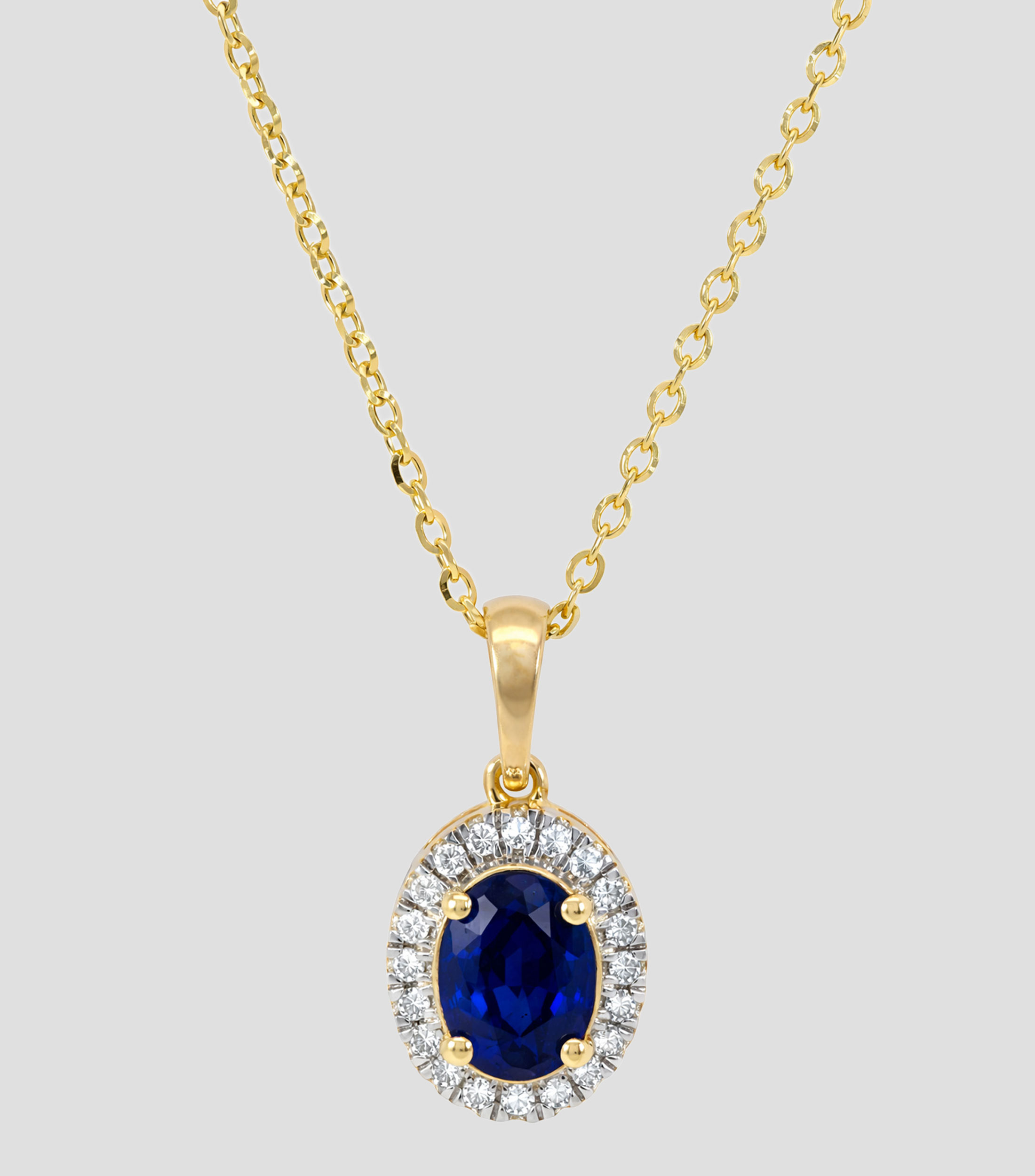 Dije con cadena en Oro de 14 Kilates con brillante y zafiro Mujer