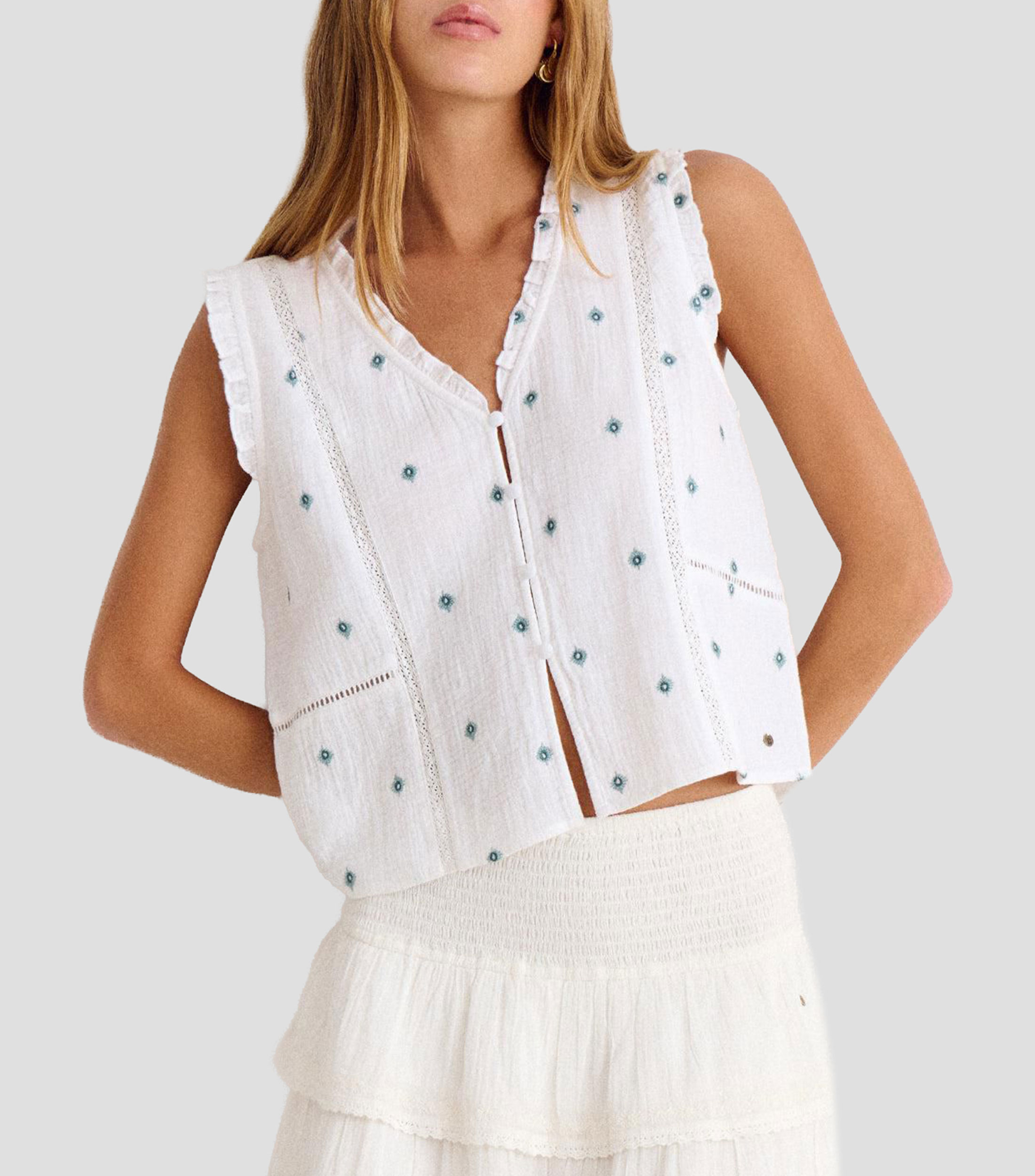 Blusa con bordado y sin mangas Mujer