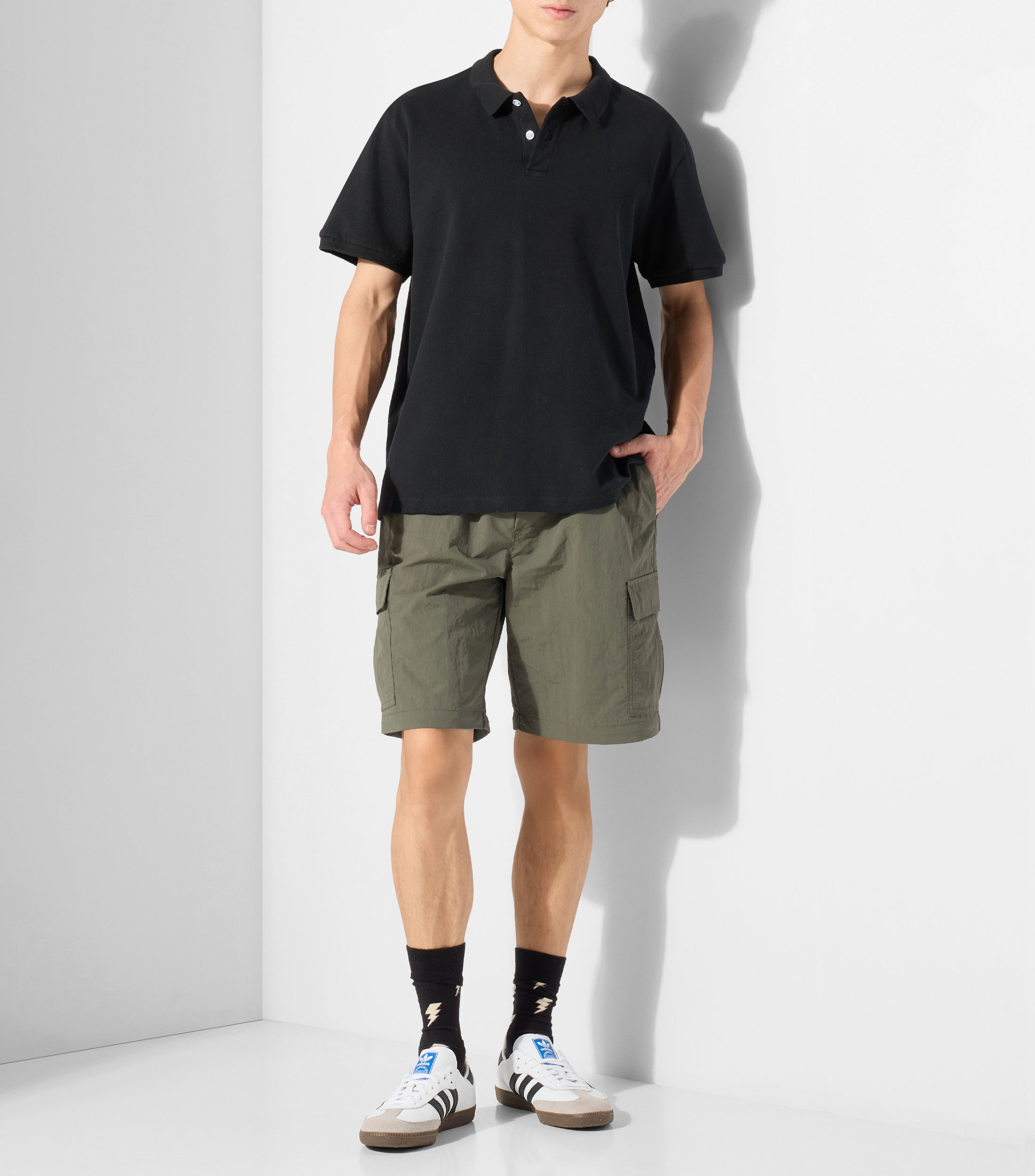 Playera tipo polo con manga corta lisa Hombre