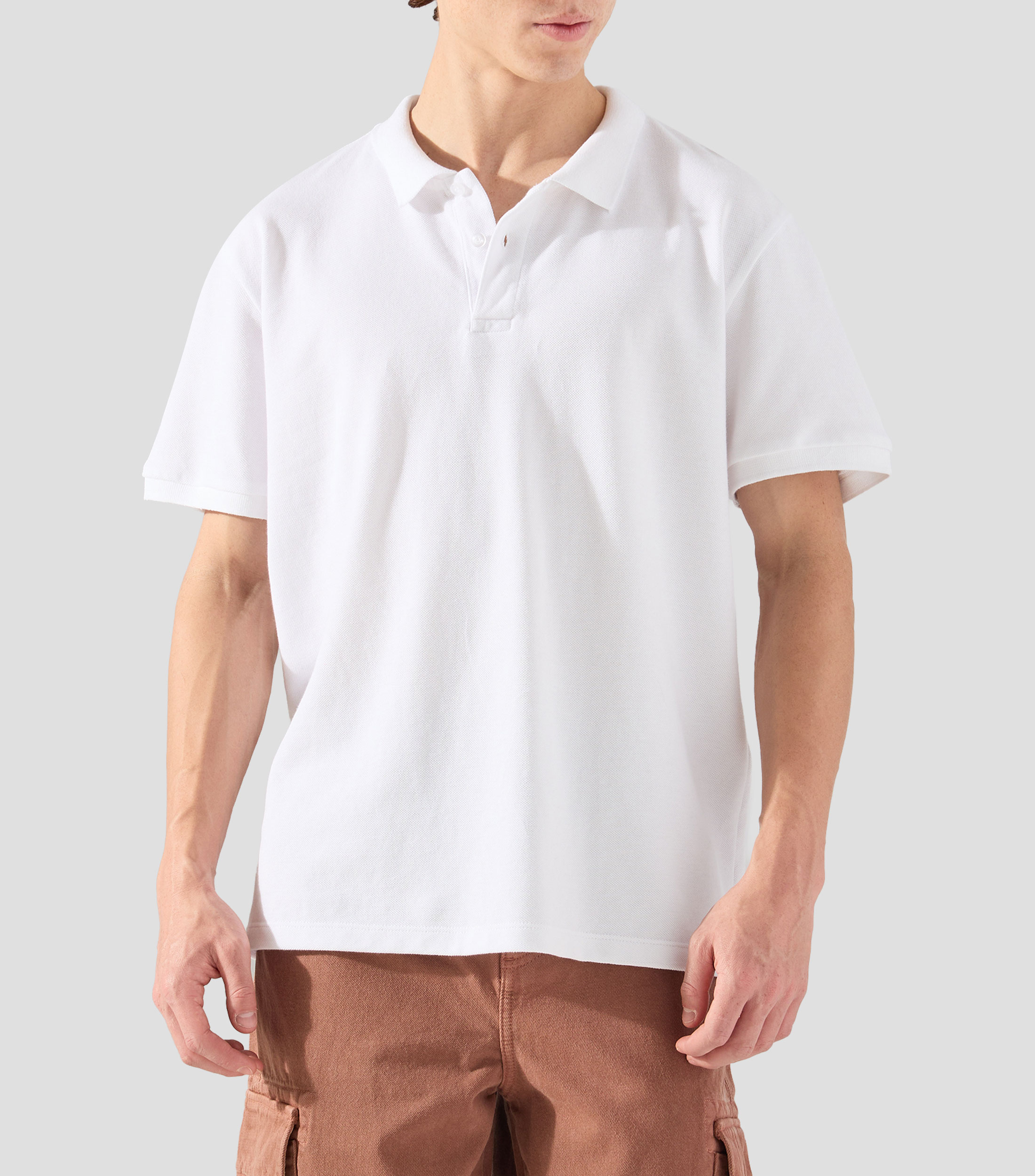Playera tipo polo con manga corta lisa Hombre