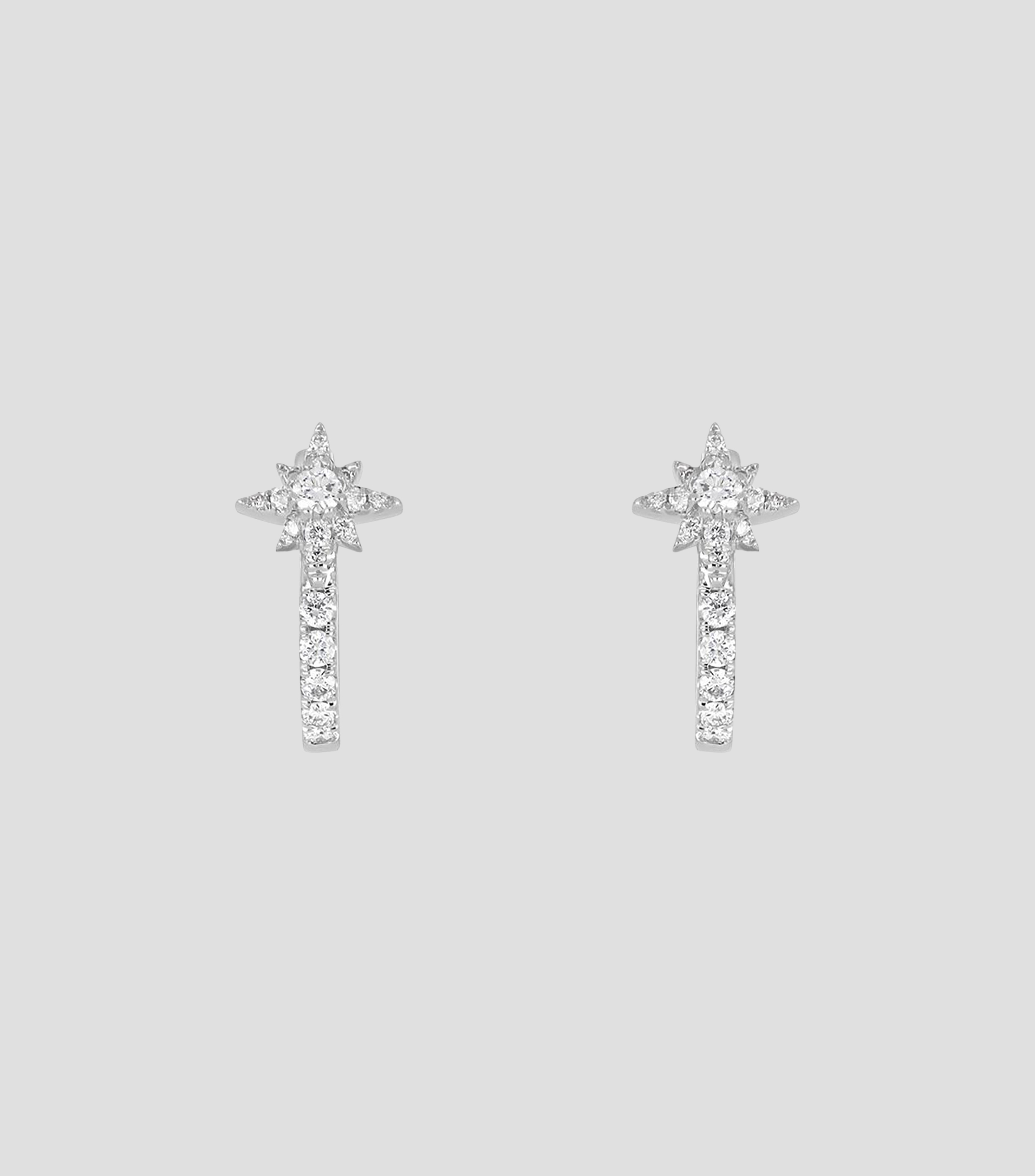 Aretes en Oro blanco de 18 Kilates con forma de estrella e incrustaciones de diamantes Mujer