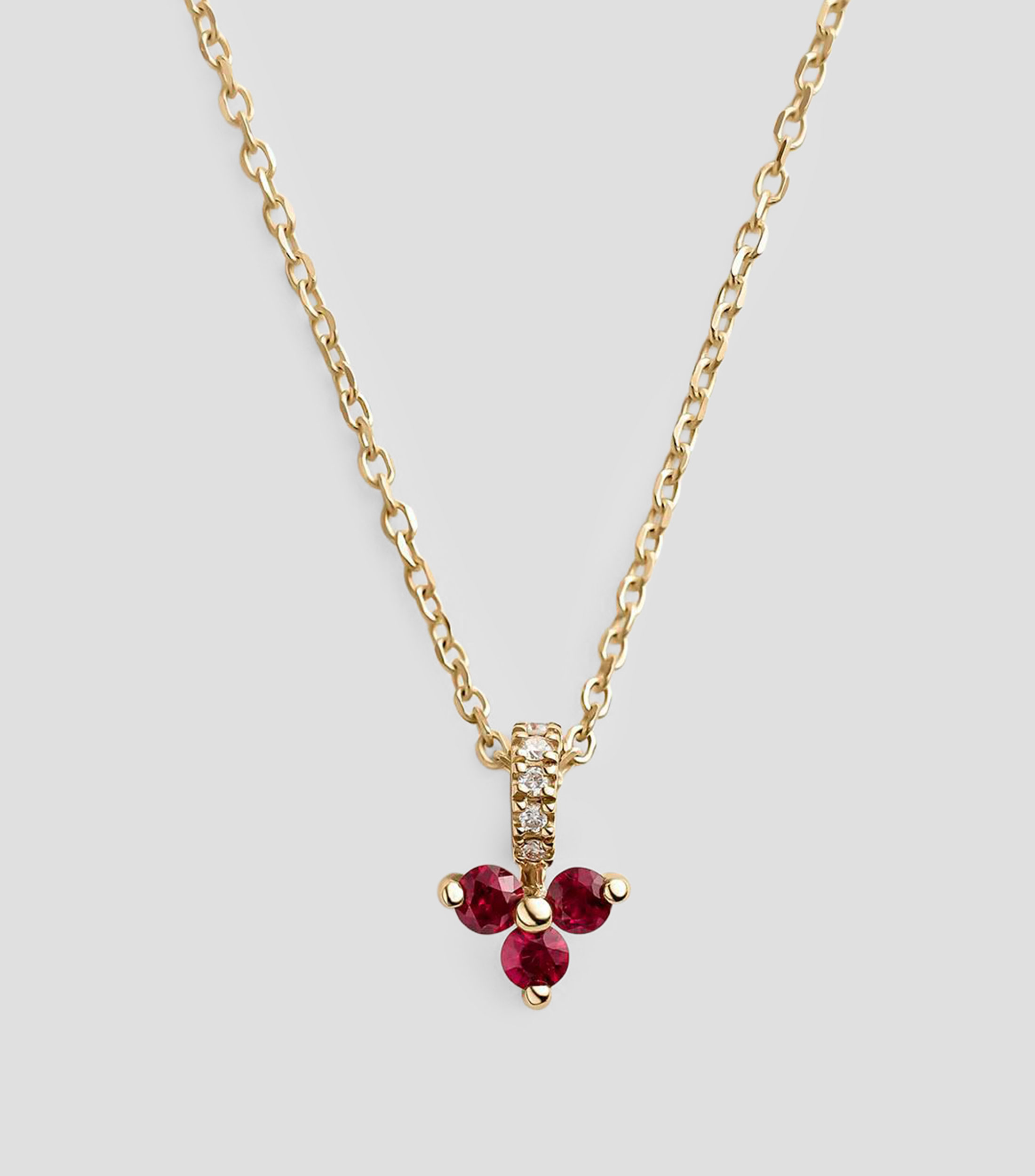 Collar en Oro amarillo 9 Kilates trébol con rubíes y diamantes Mujer
