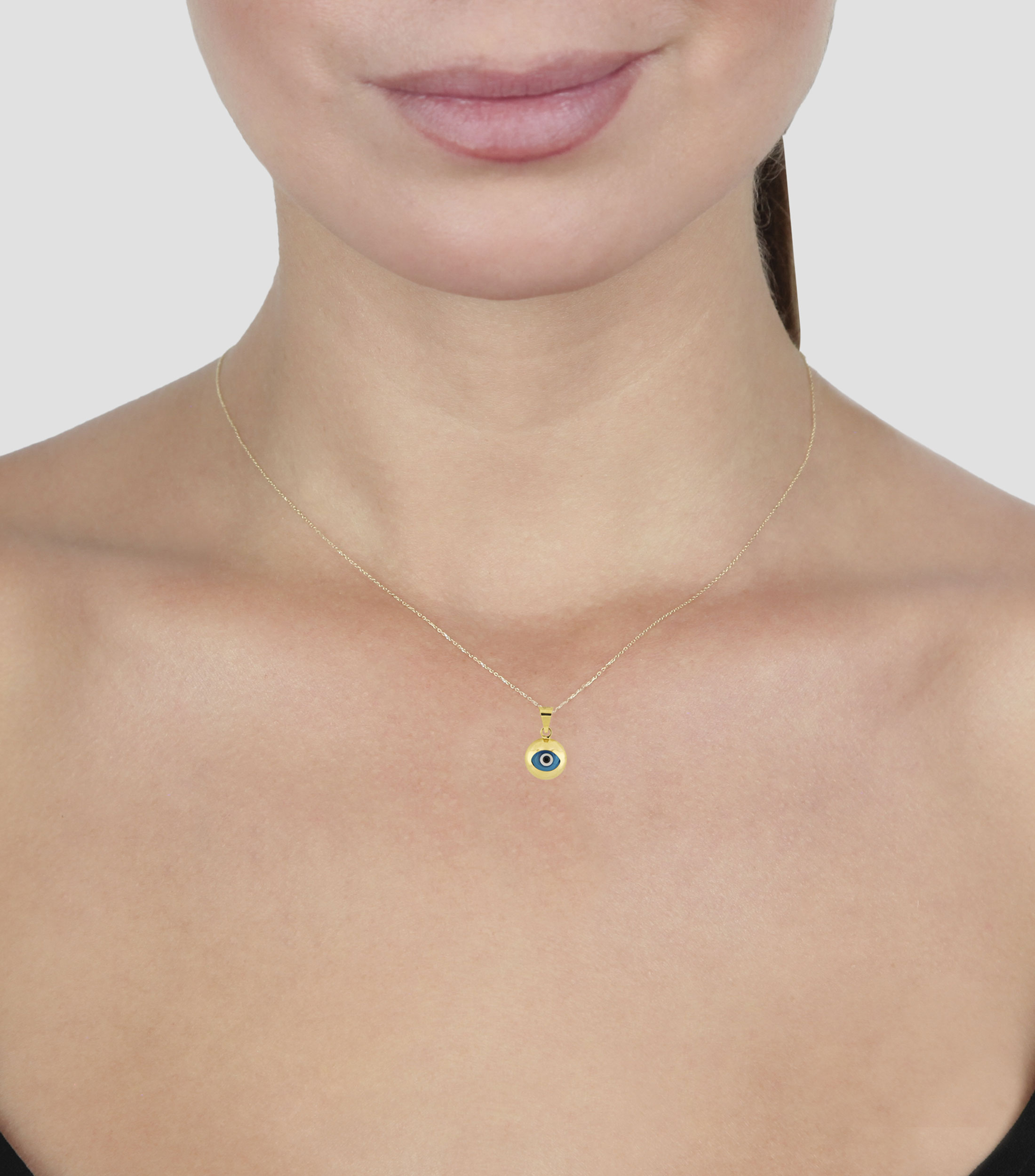 Dije de ojo en oro amarillo 14 kilates Mujer