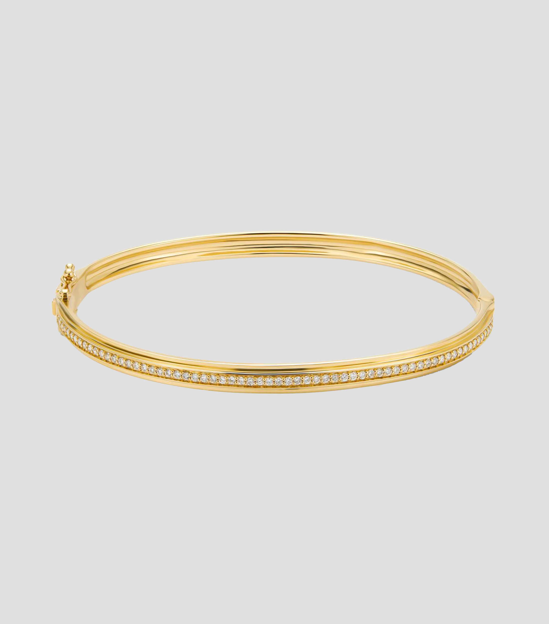 Brazalete rígido en Oro amarillo de 18 Kilates con diamantes Mujer