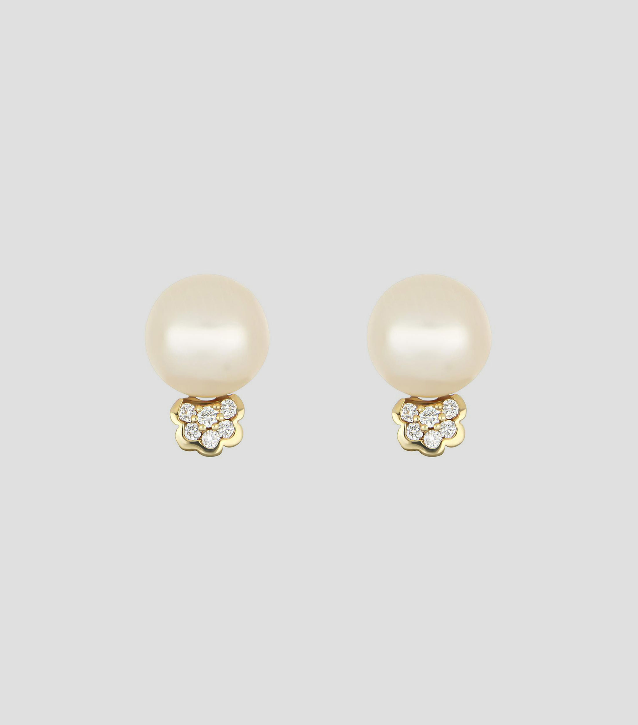 Aretes en oro amarillo de 14 kilates con perla Mujer