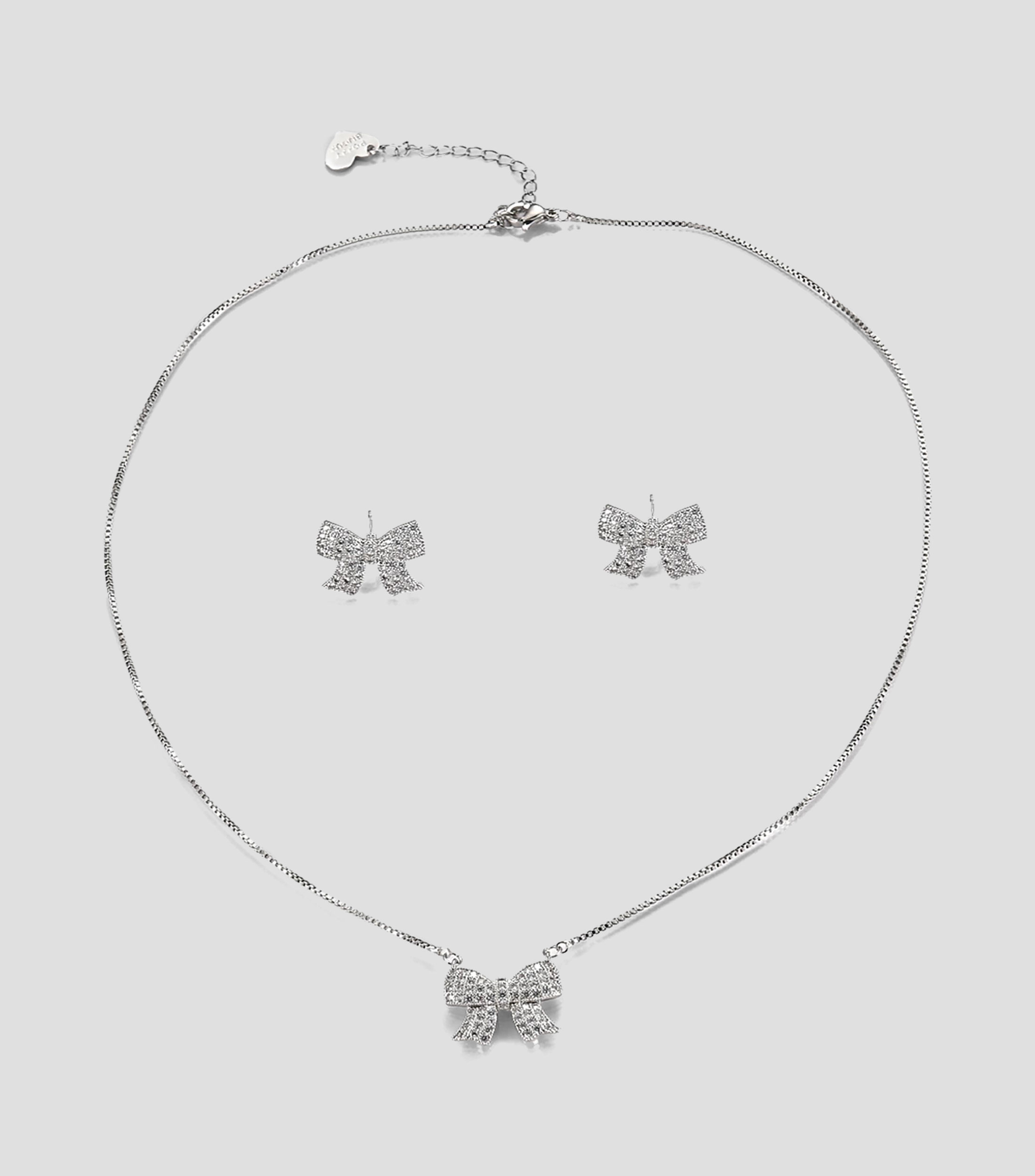 Set collar y aretes moño con zirconias Mujer