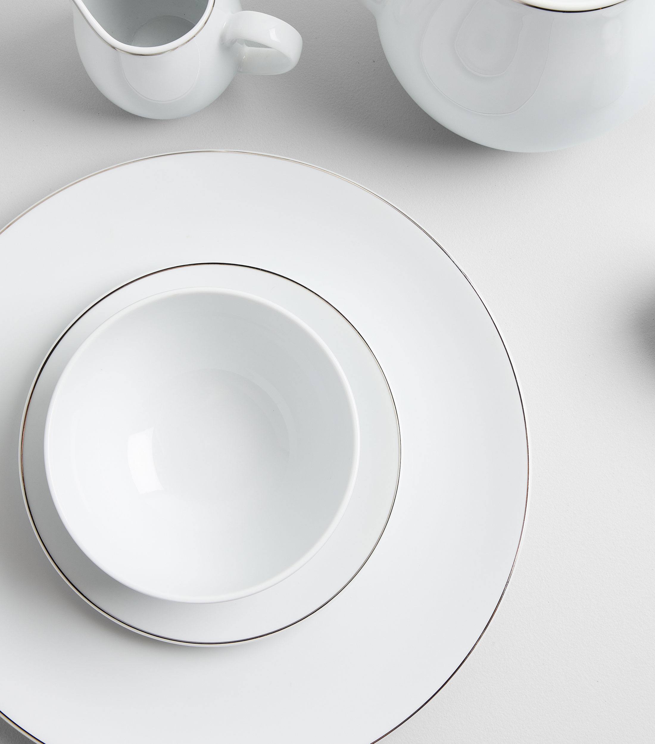 Plato trinche Bright en porcelana blanca