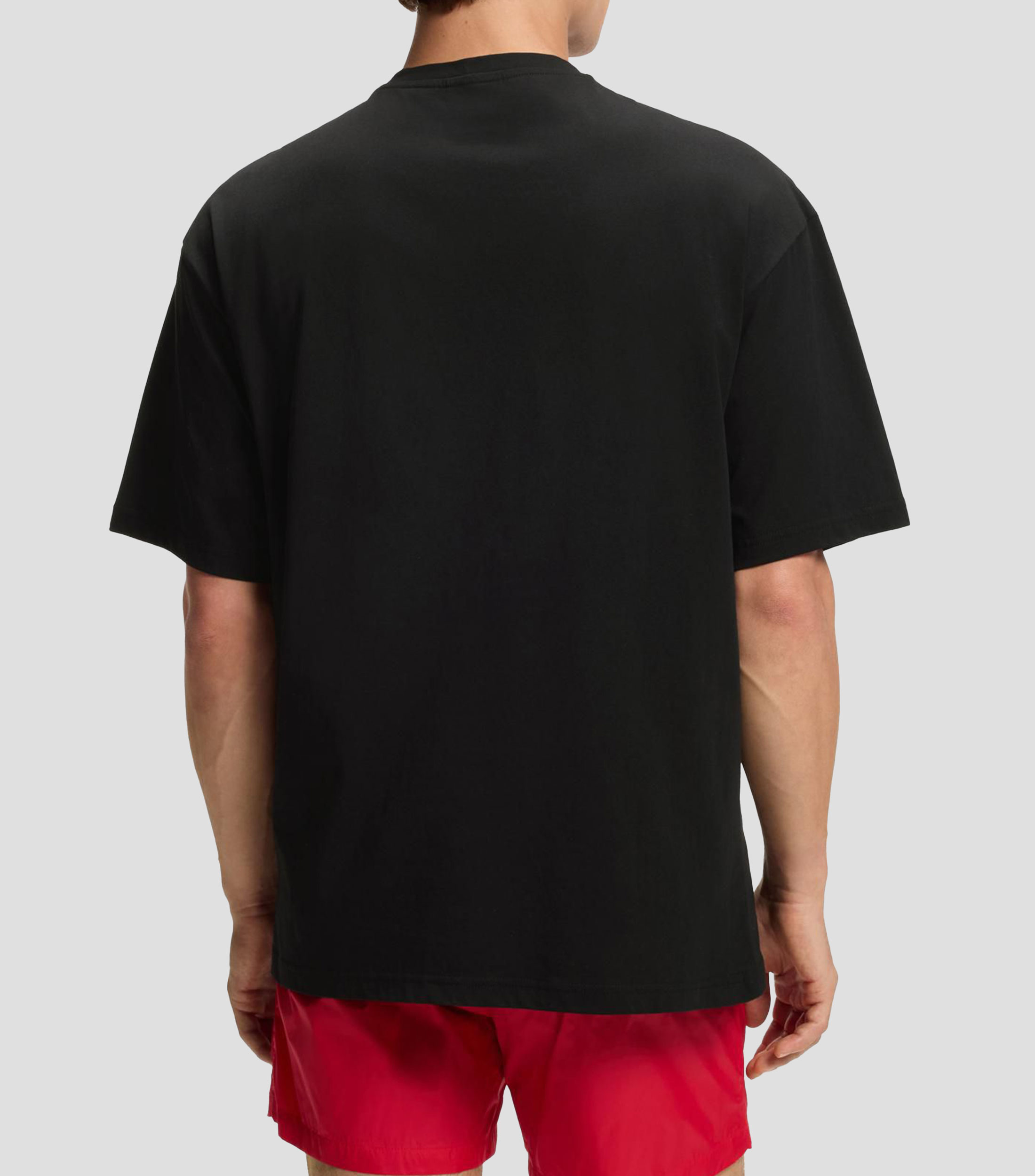 Playera oversized fit de algodón con estampado de logos repetidos Hombre