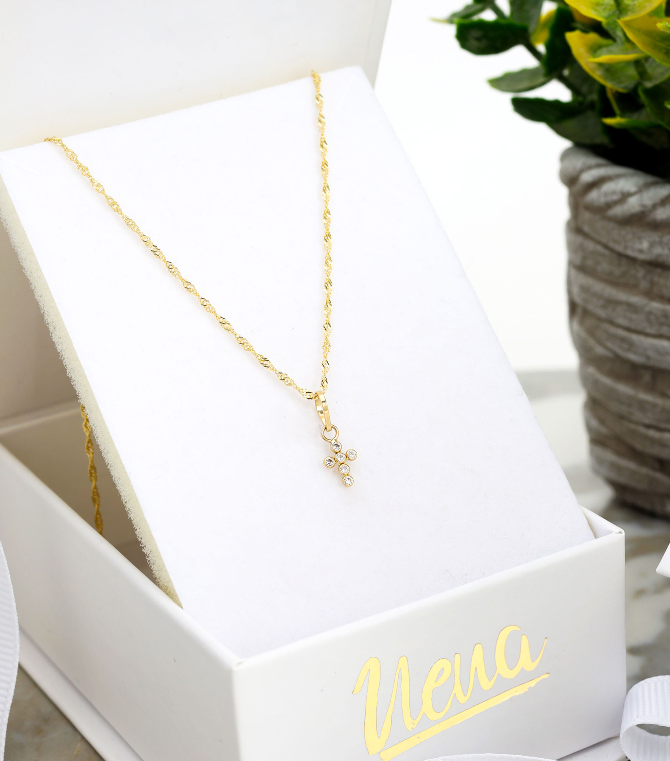 Dije de cruz en oro con zirconia Bebé