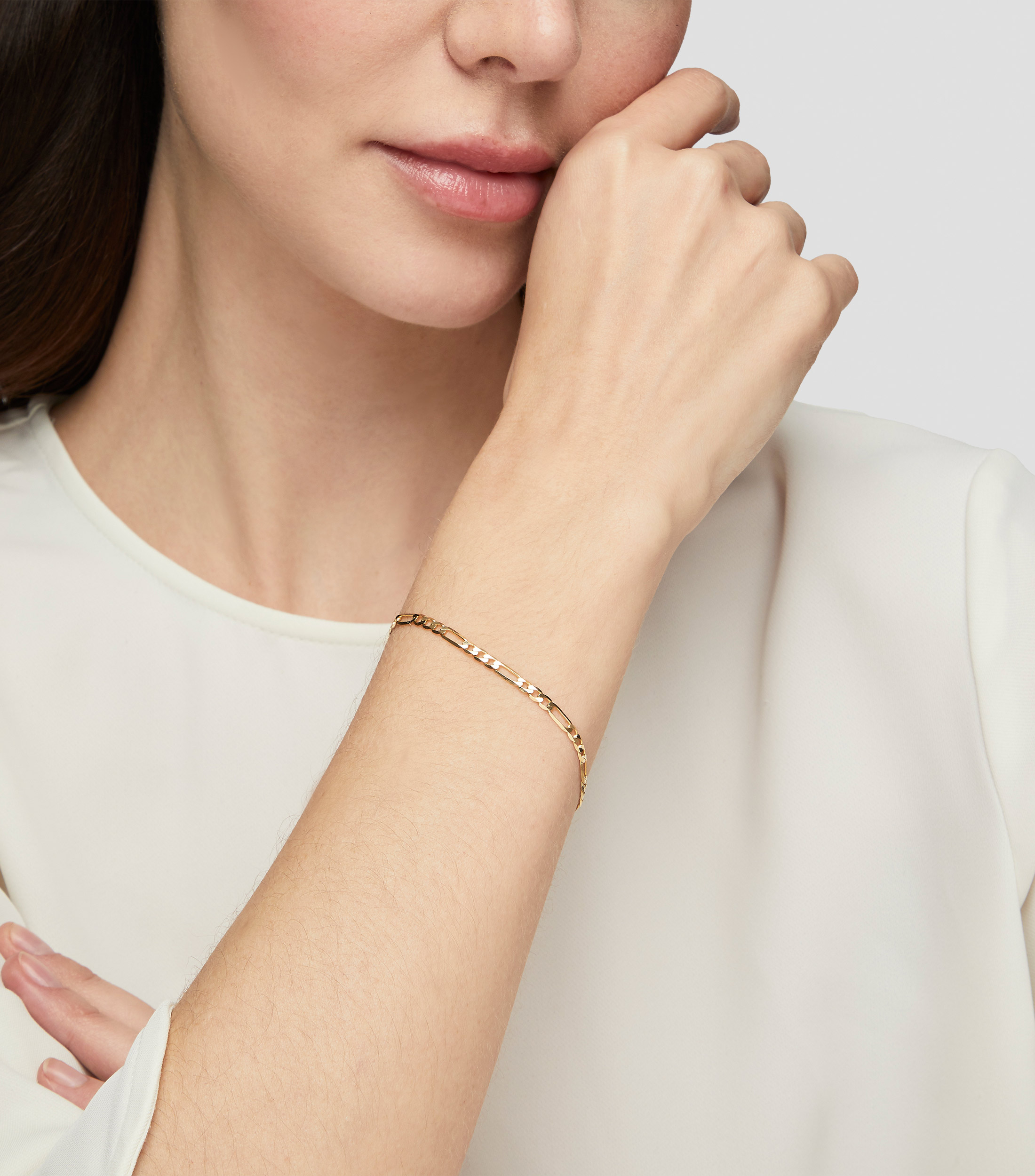 Pulsera en oro de 14 kilates entrelazada Mujer