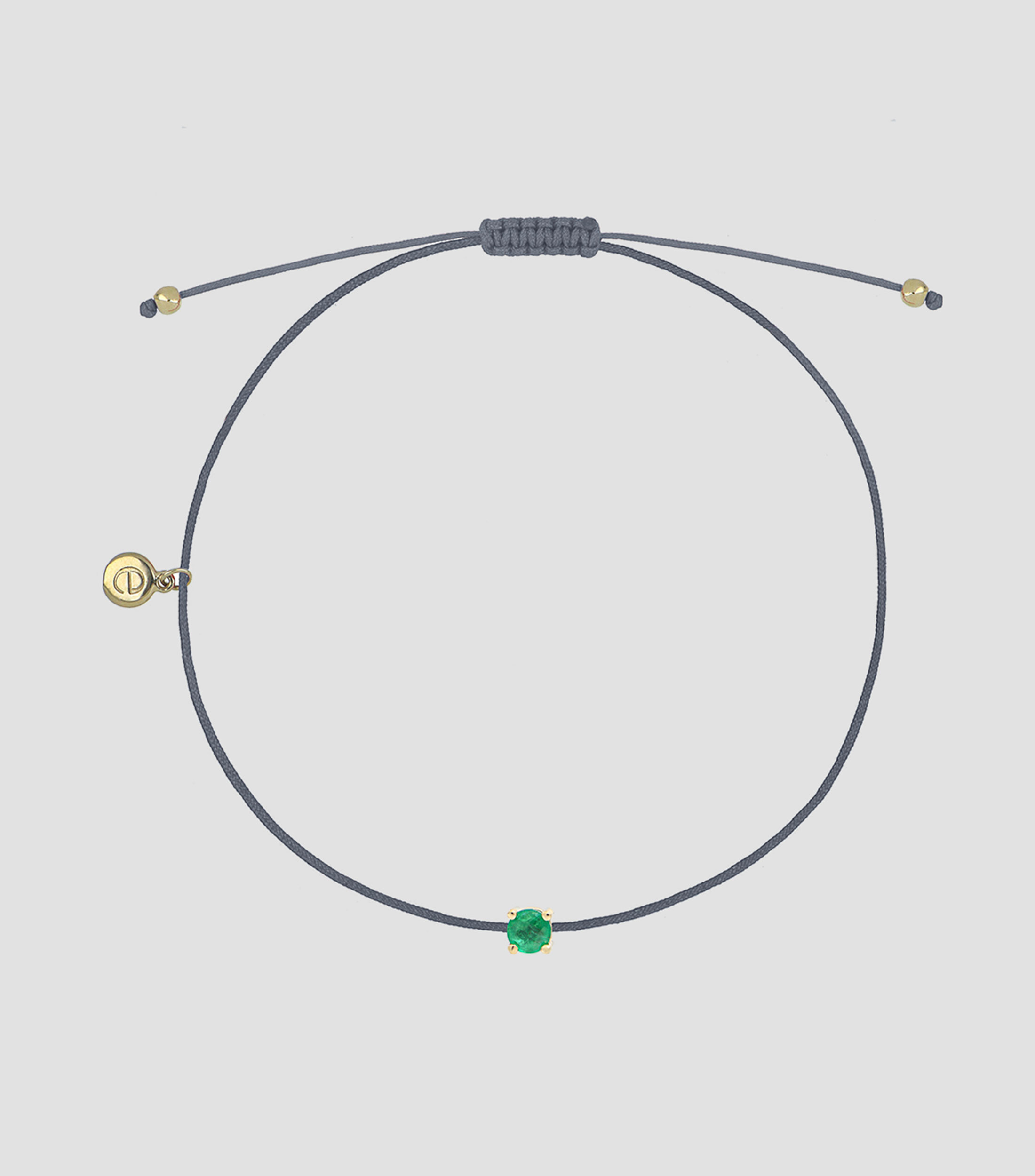 Pulsera en hilo azul pizarra con dije esmeralda Mujer