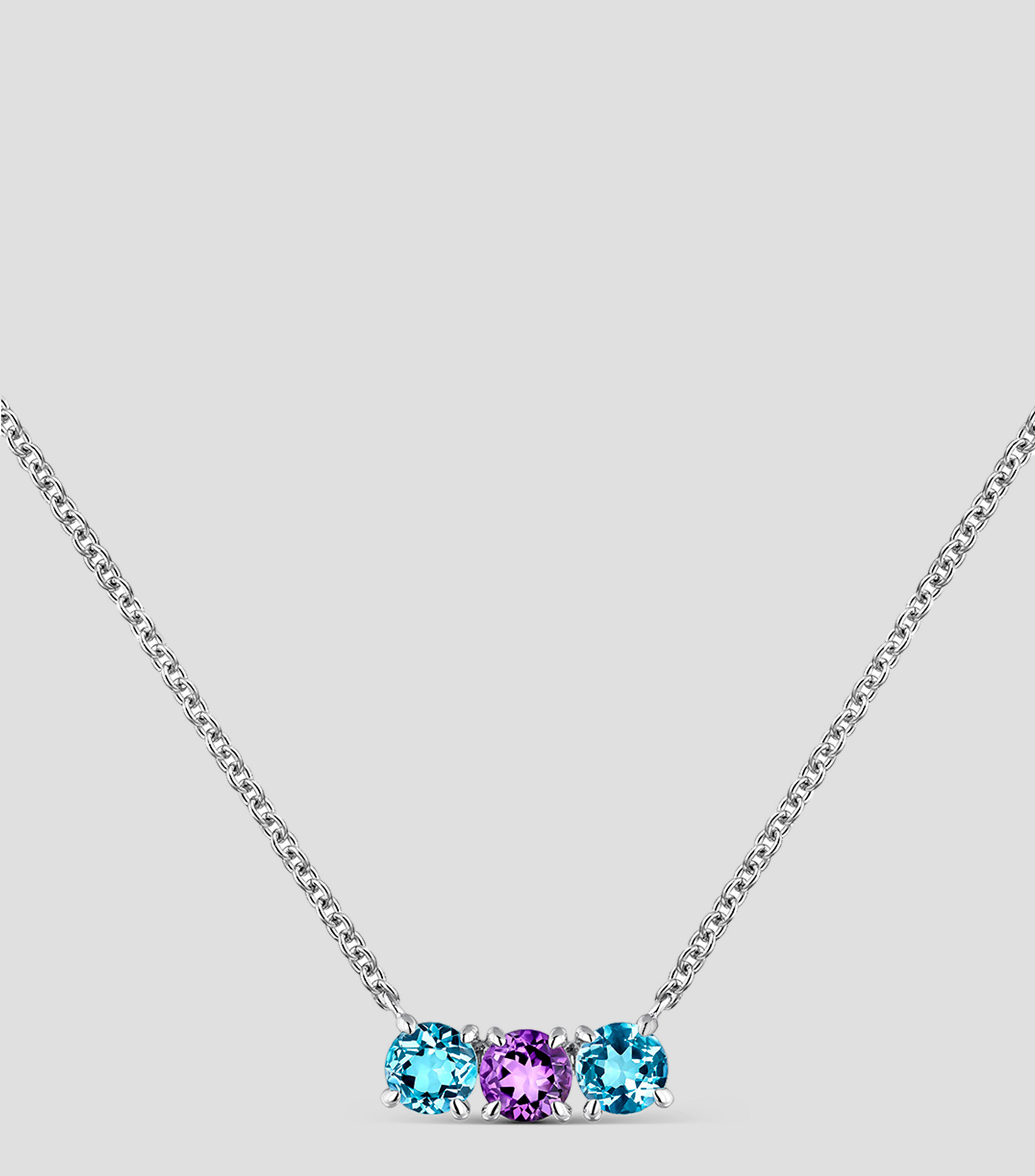 Colgante tresillo de plata 925 con topacios azuls swiss y amatista morada