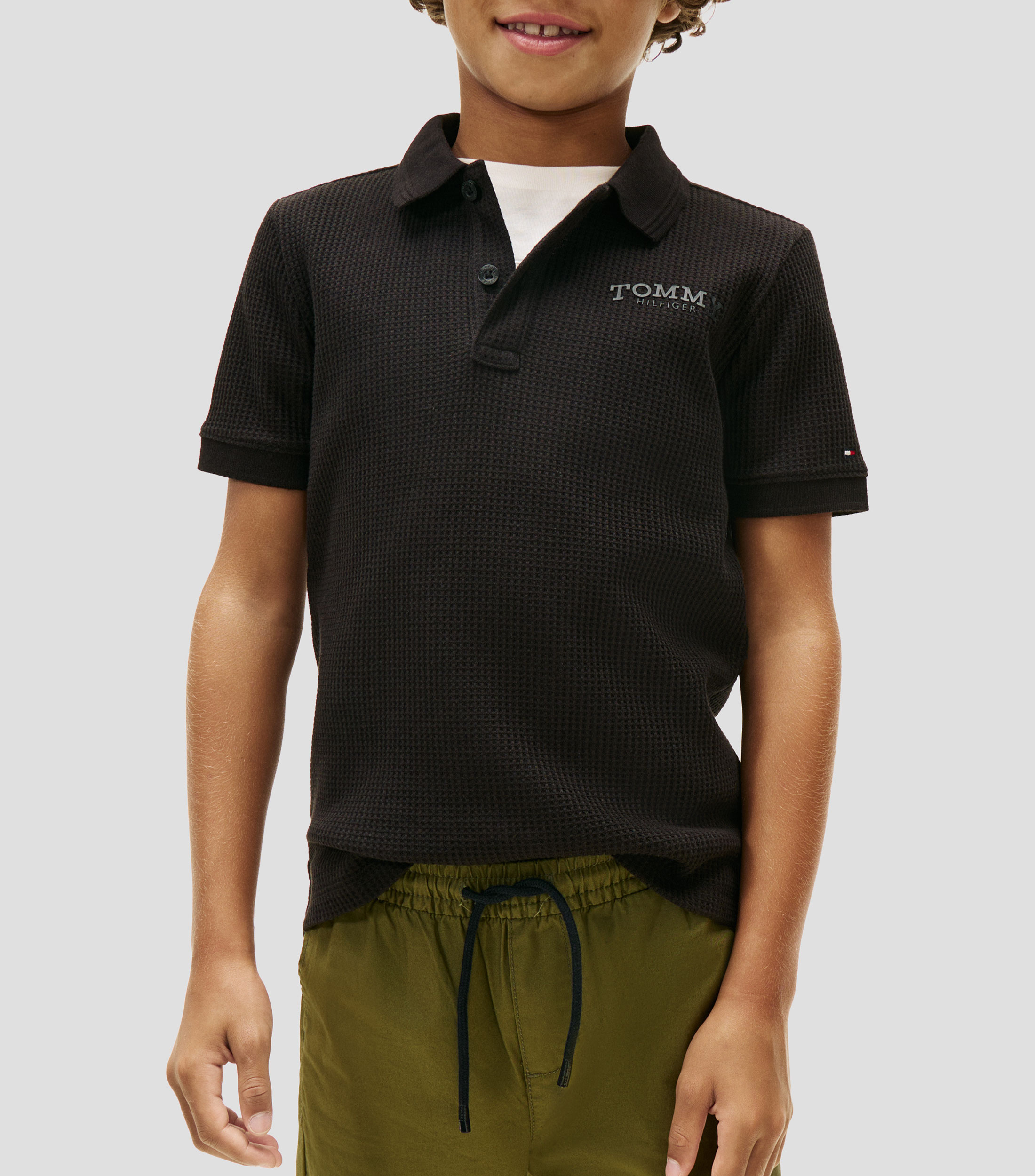 Playera tipo polo de manga corta lisa Niño