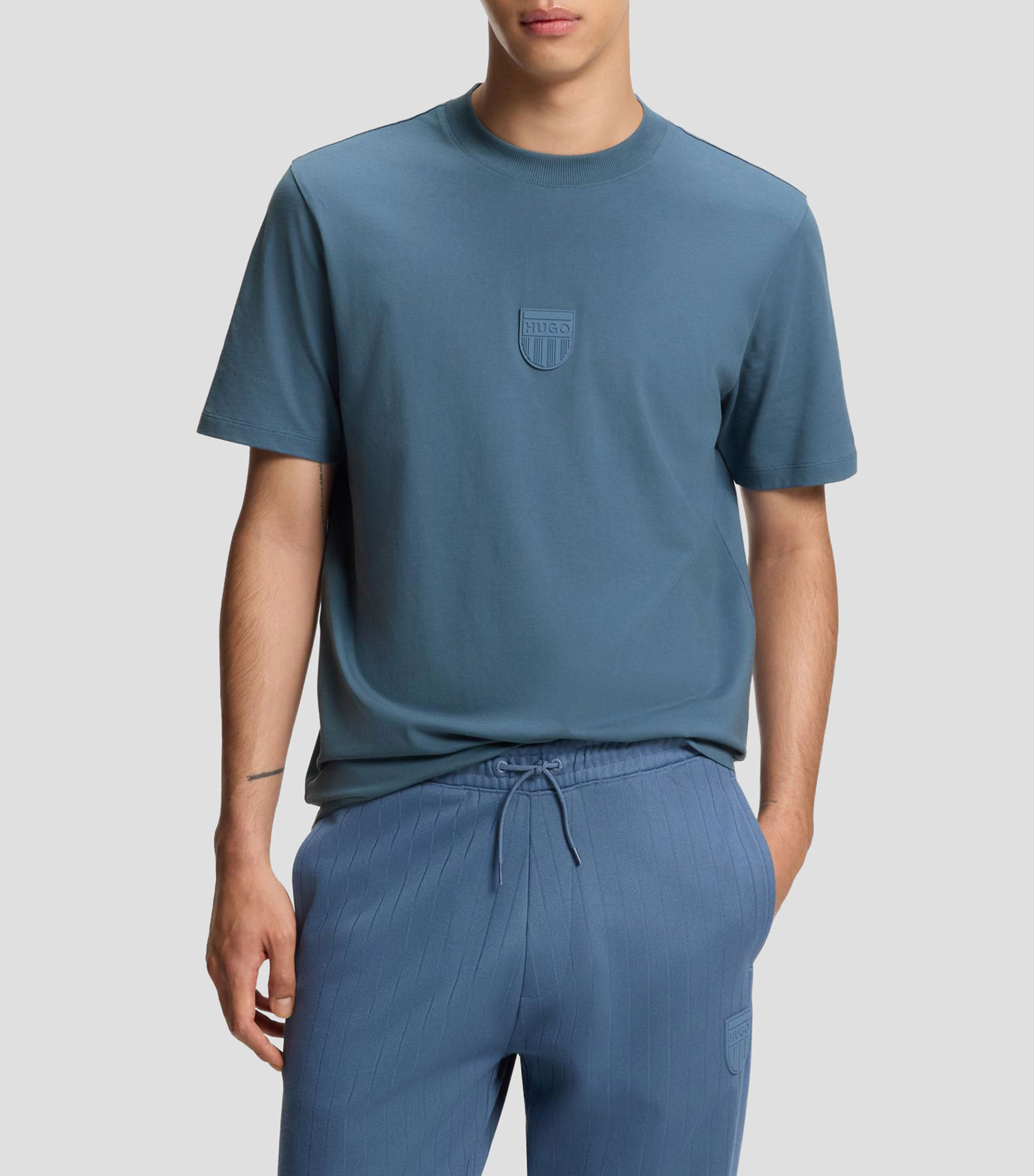 Playera de punto de algodón con logo de goma Hombre