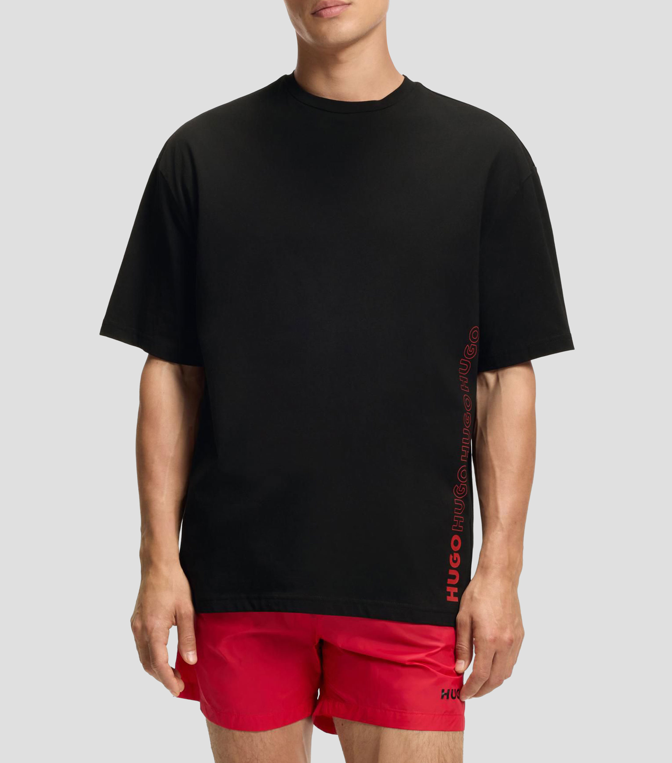Playera oversized fit de algodón con estampado de logos repetidos Hombre