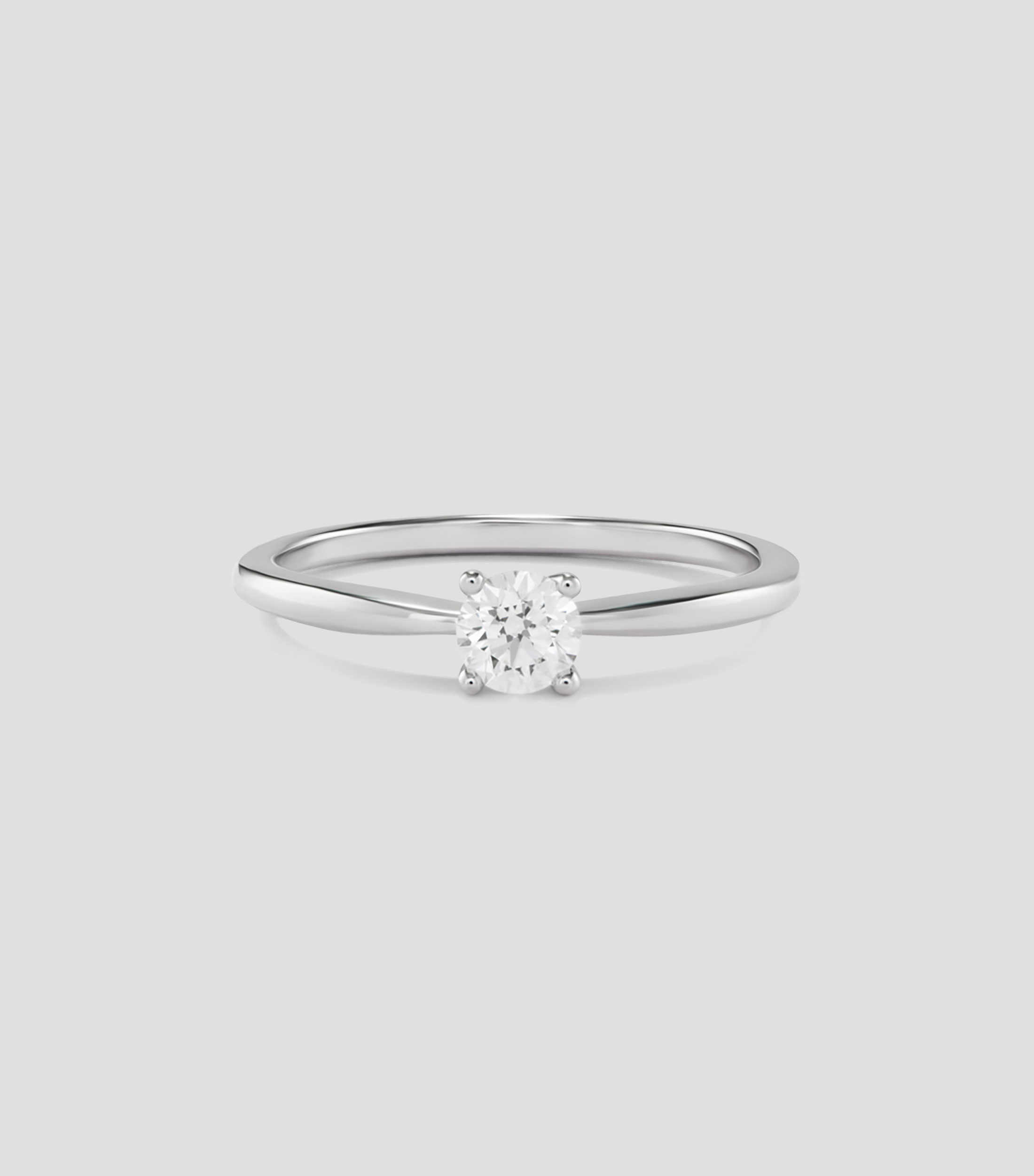 Anillo solitario en Oro blanco de 18 Kilates con diamante central Mujer