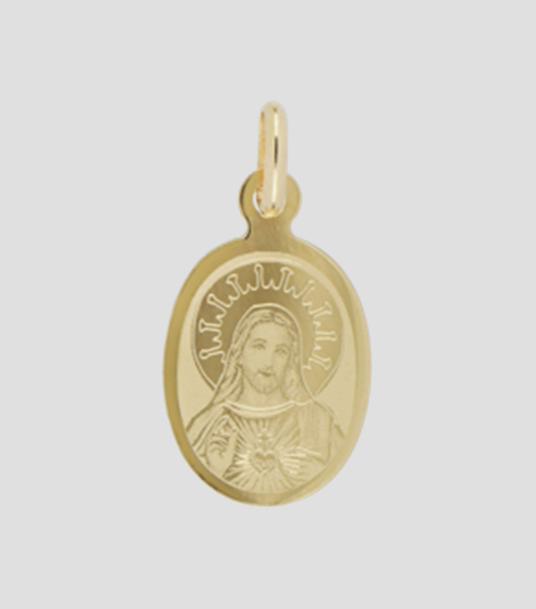 Medalla en oro amarillo 14 Kilates Sagrado Corazon Unisex