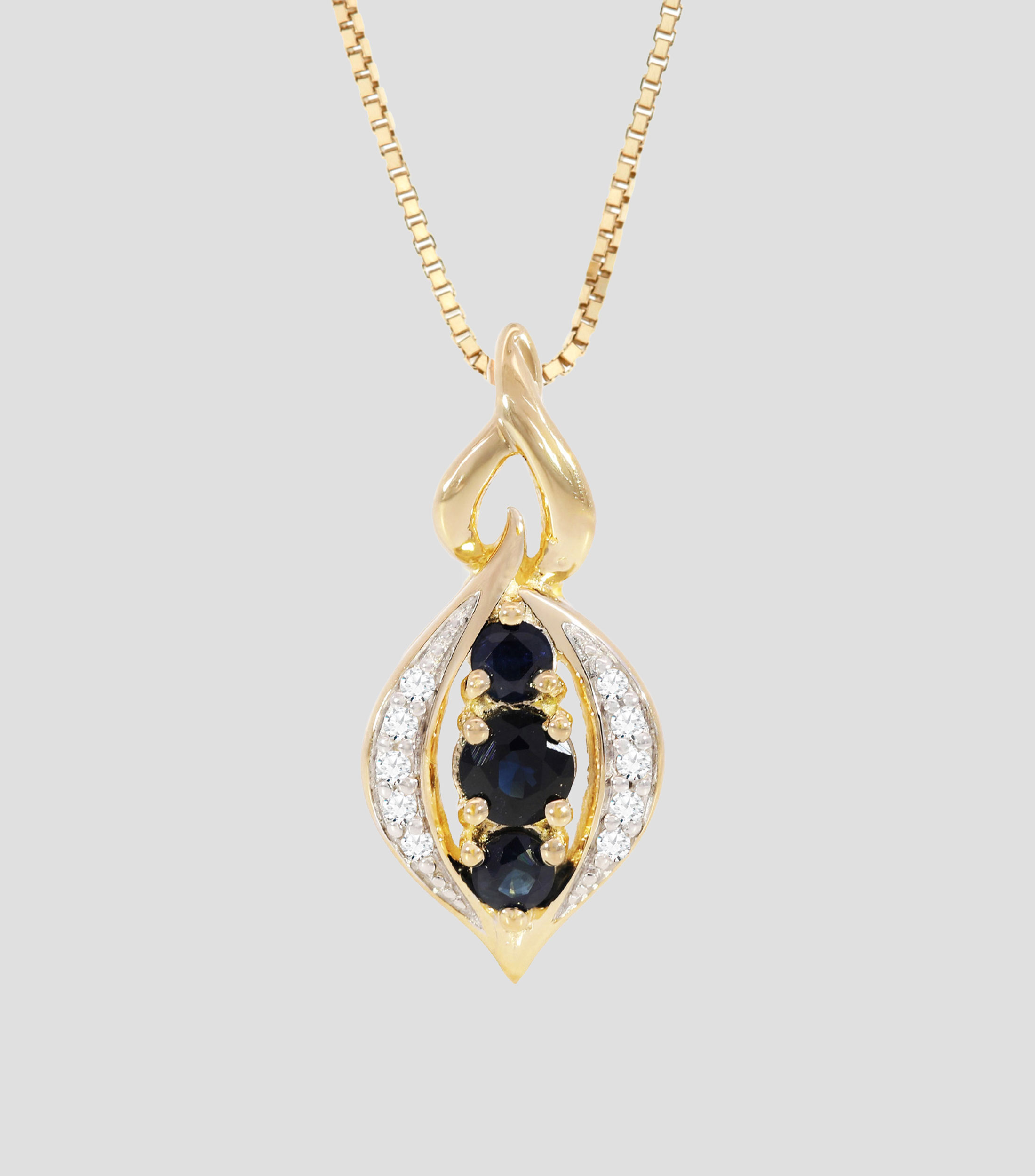 Dije con cadena en oro amarillo de 14 kilates con zafiros y diamantes Mujer
