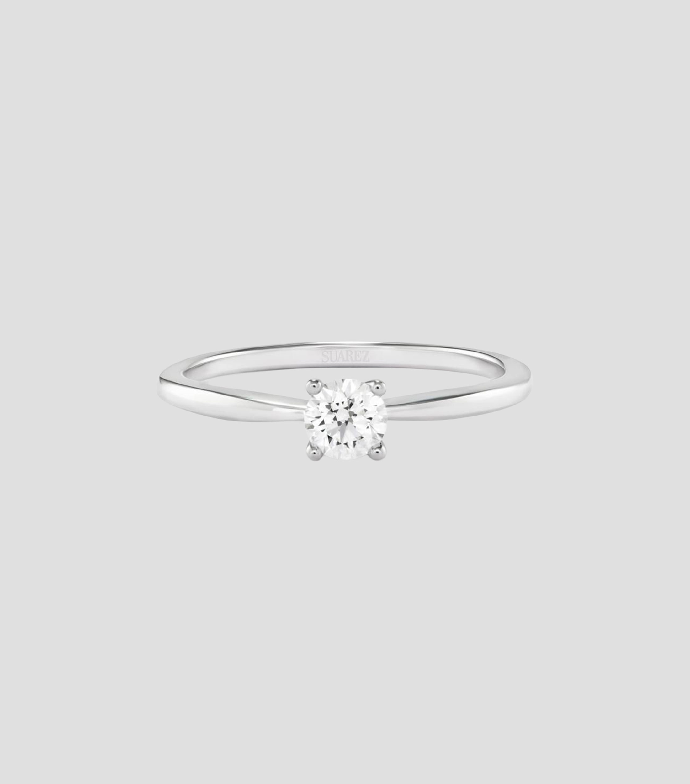 Anillo solitario en Oro blanco de 18 Kilates con diamante Mujer