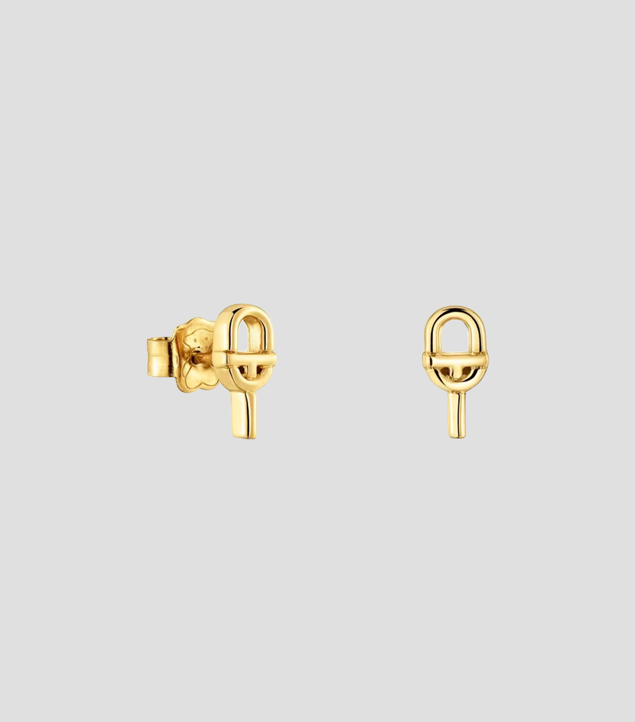 Aretes Manifesto en plata dorada Mujer