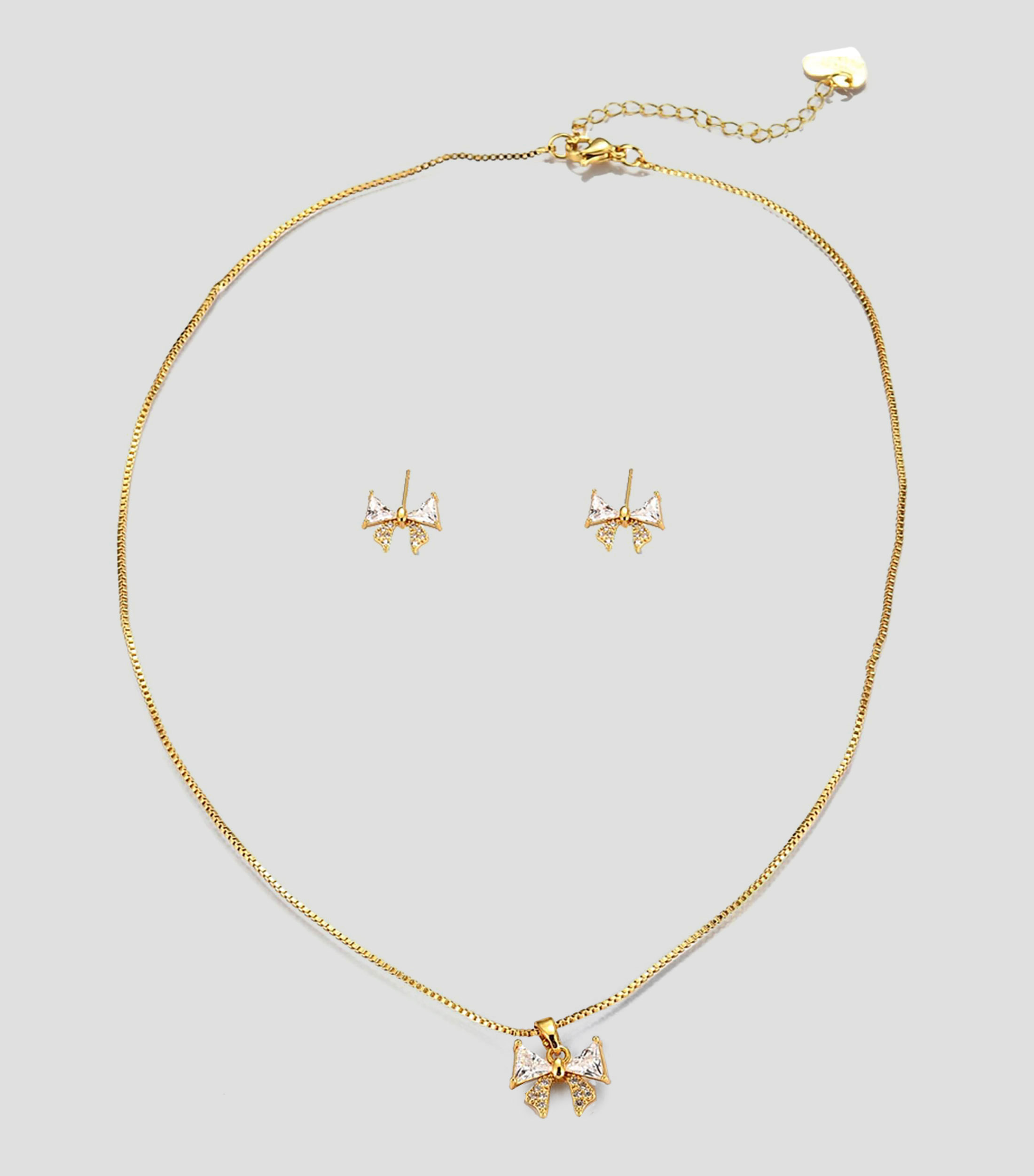 Set de collar y aretes moño con zirconias Mujer