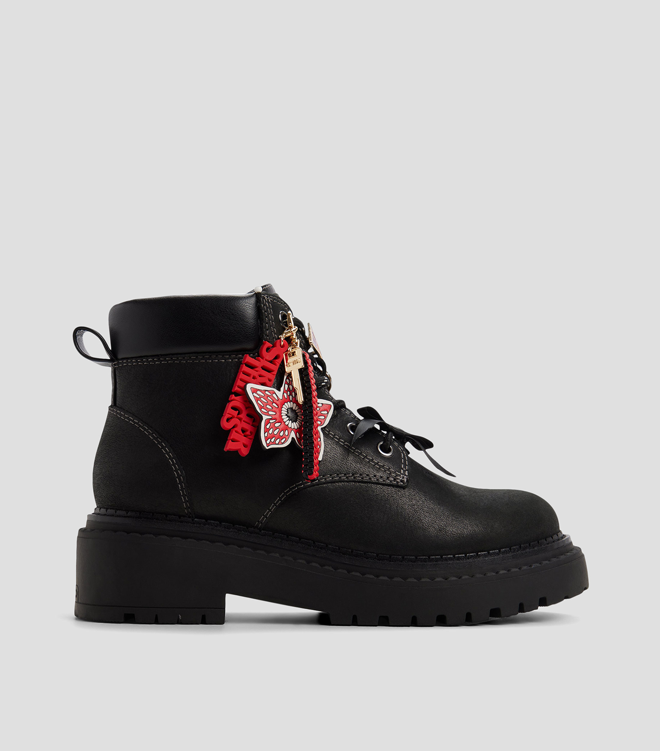 Botines en piel de tacón bajo de media luna Mujer