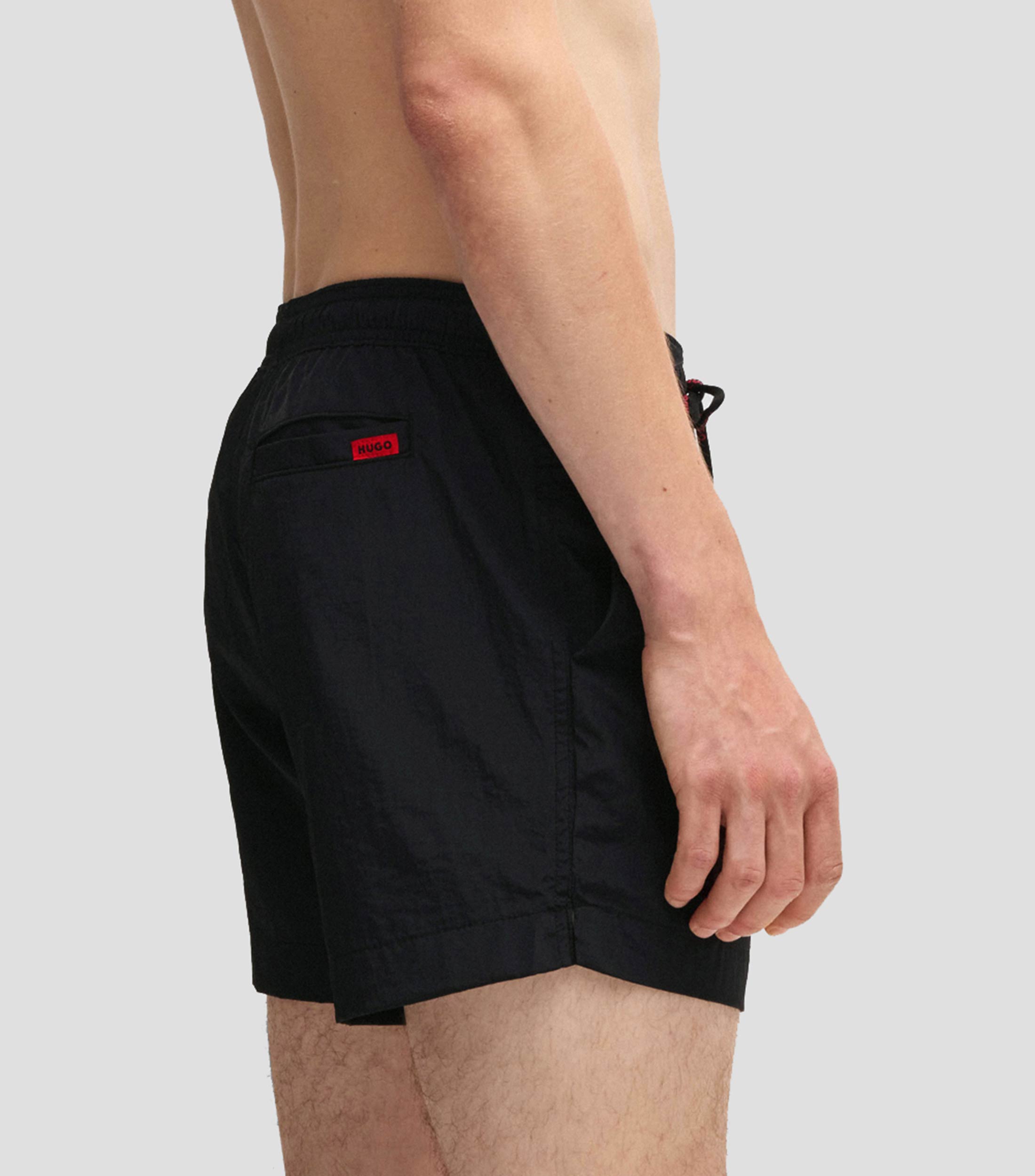 Traje de baño tipo short con forro integral y etiqueta de logo roja Hombre