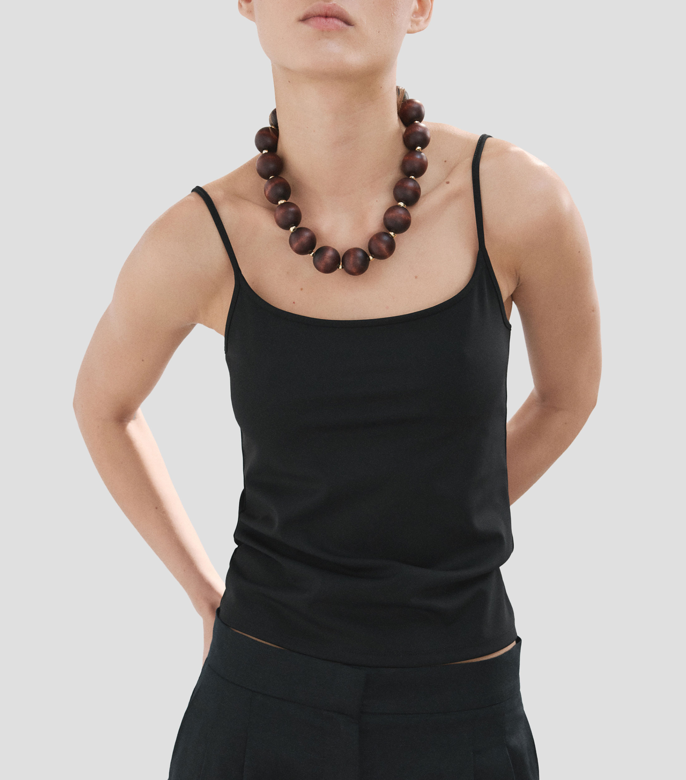 Blusa lisa sin mangas Mujer