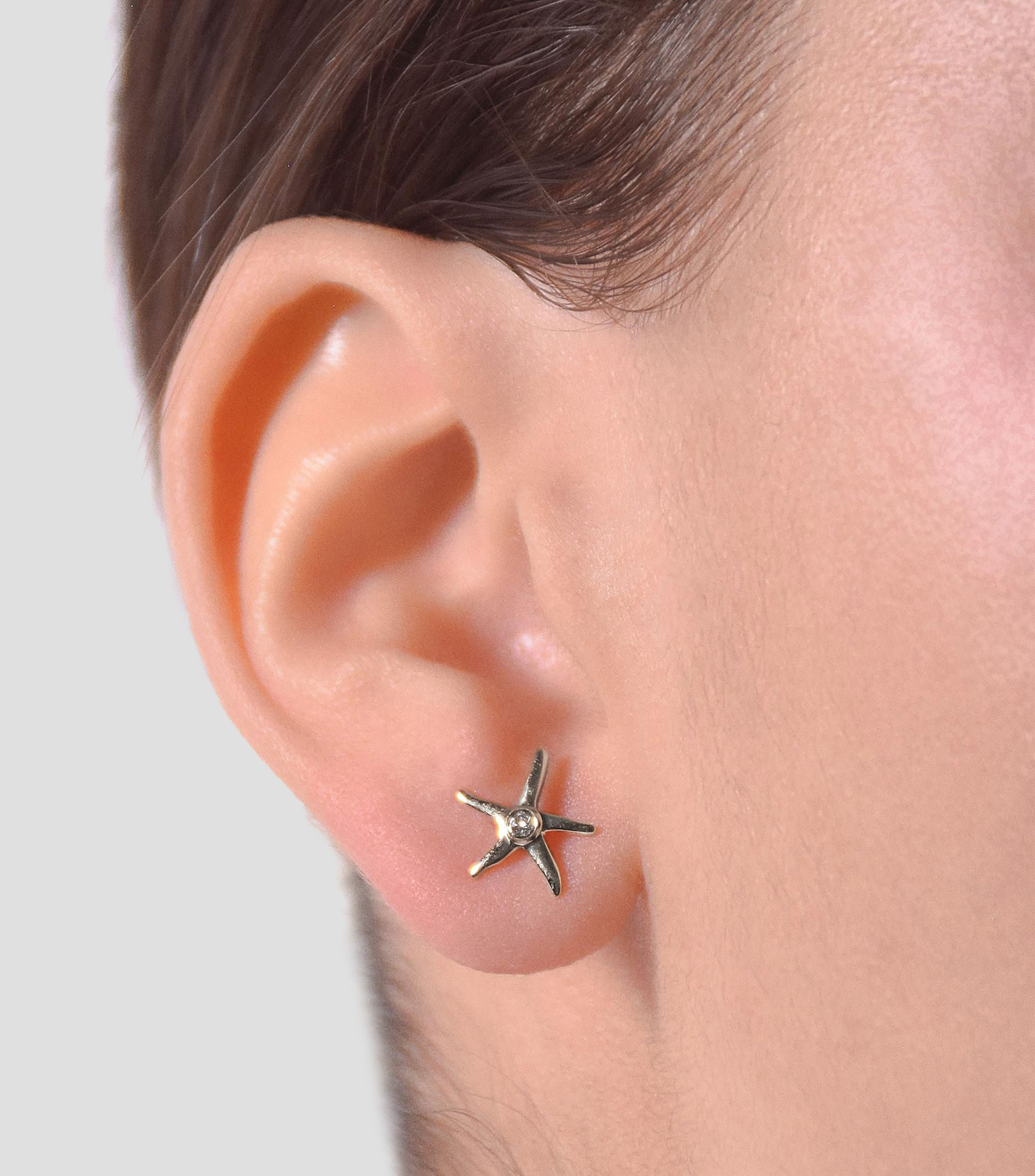Broquele en Oro blanco de 18 Kilates en forma de estrella de mar con diamantes Mujer